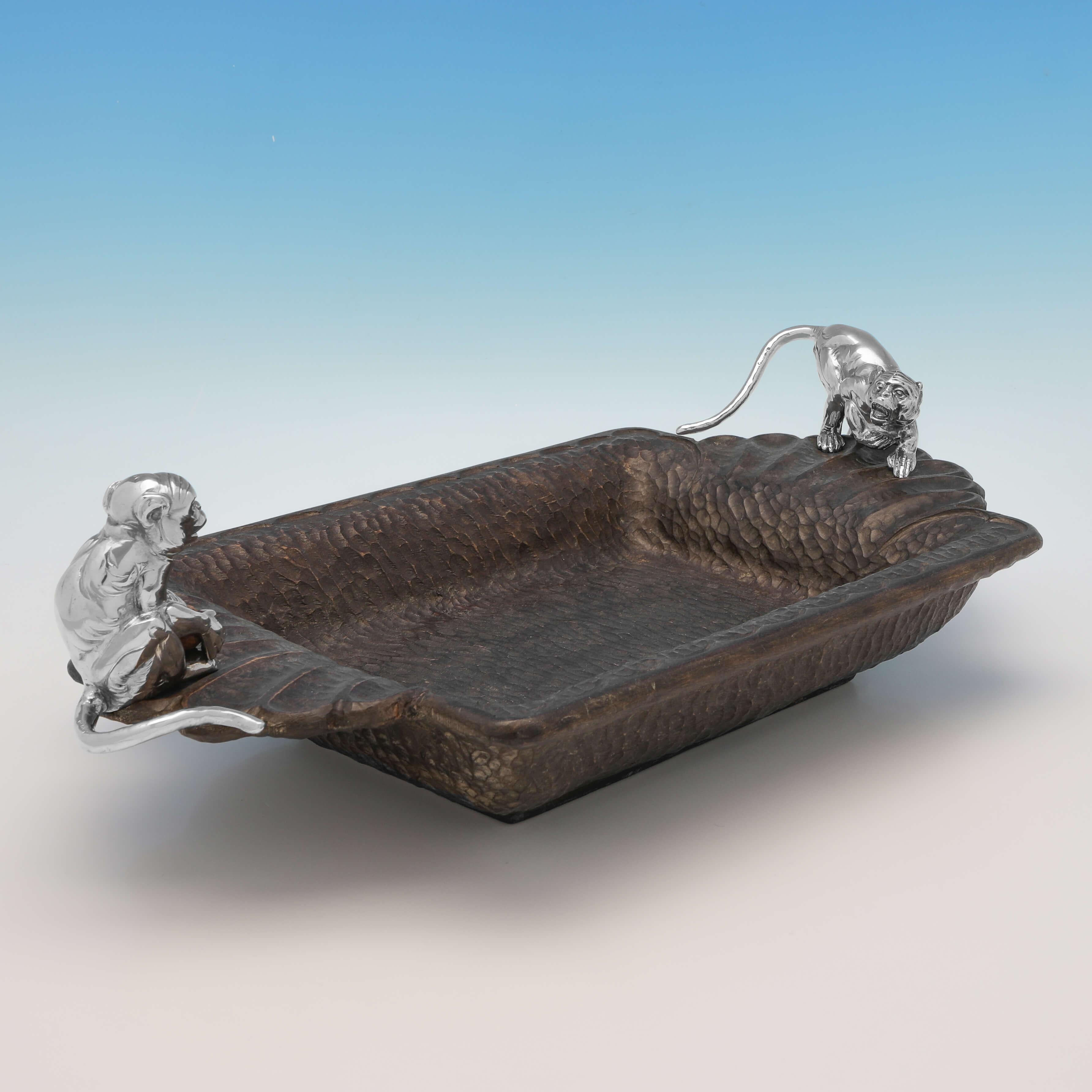 Made circa 1900 by J.D. Schleissner & Sohne, this striking Antique 800 Standard German Silver Nut Dish, features 2 silver models of monkeys to either side, with the body made out of a nut wood. 

The nut dish measures 5