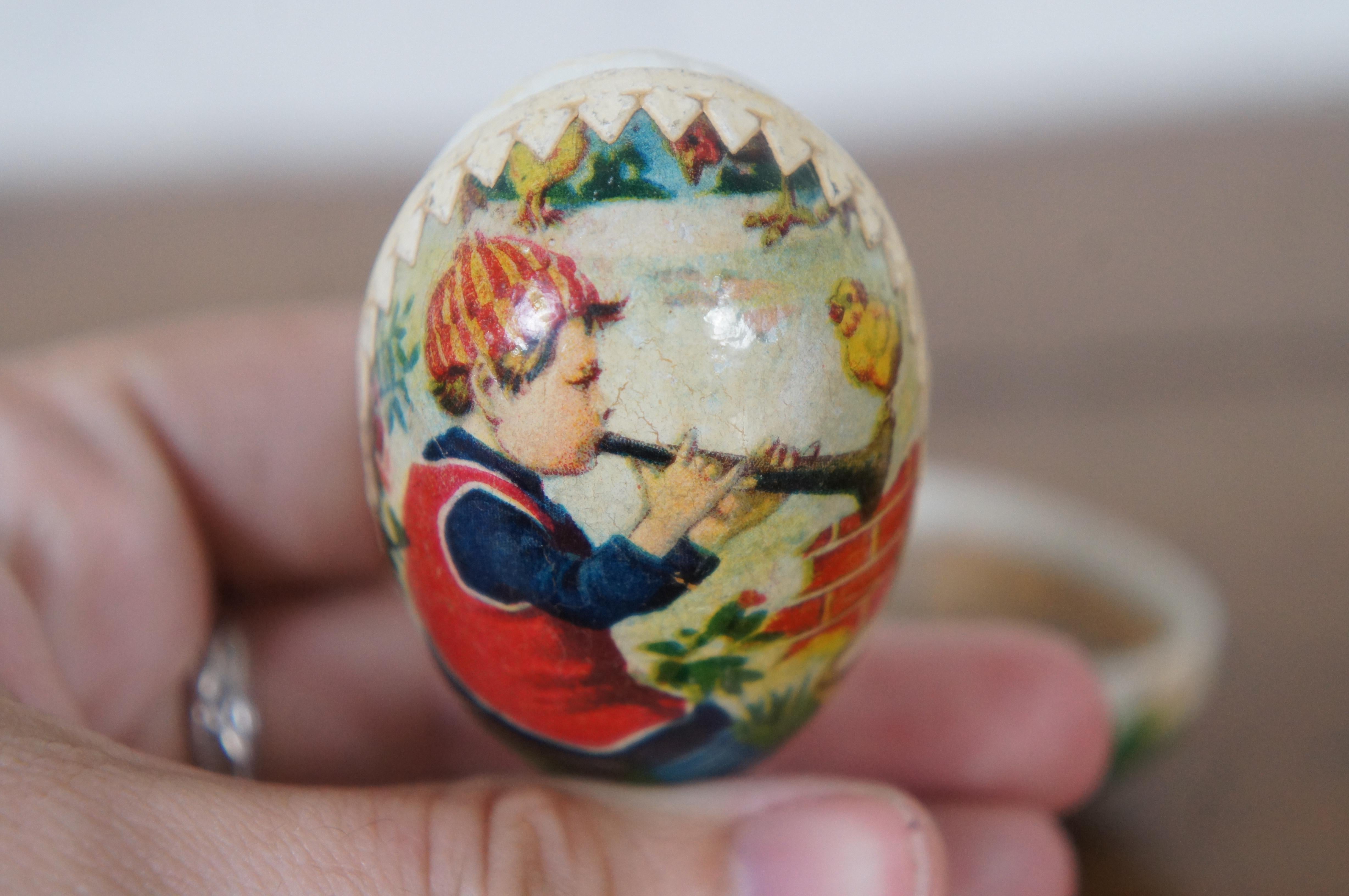 Antique Oeuf de Pâques en papier mâché contenant des bonbons Garçon jouant de la corne 2.25