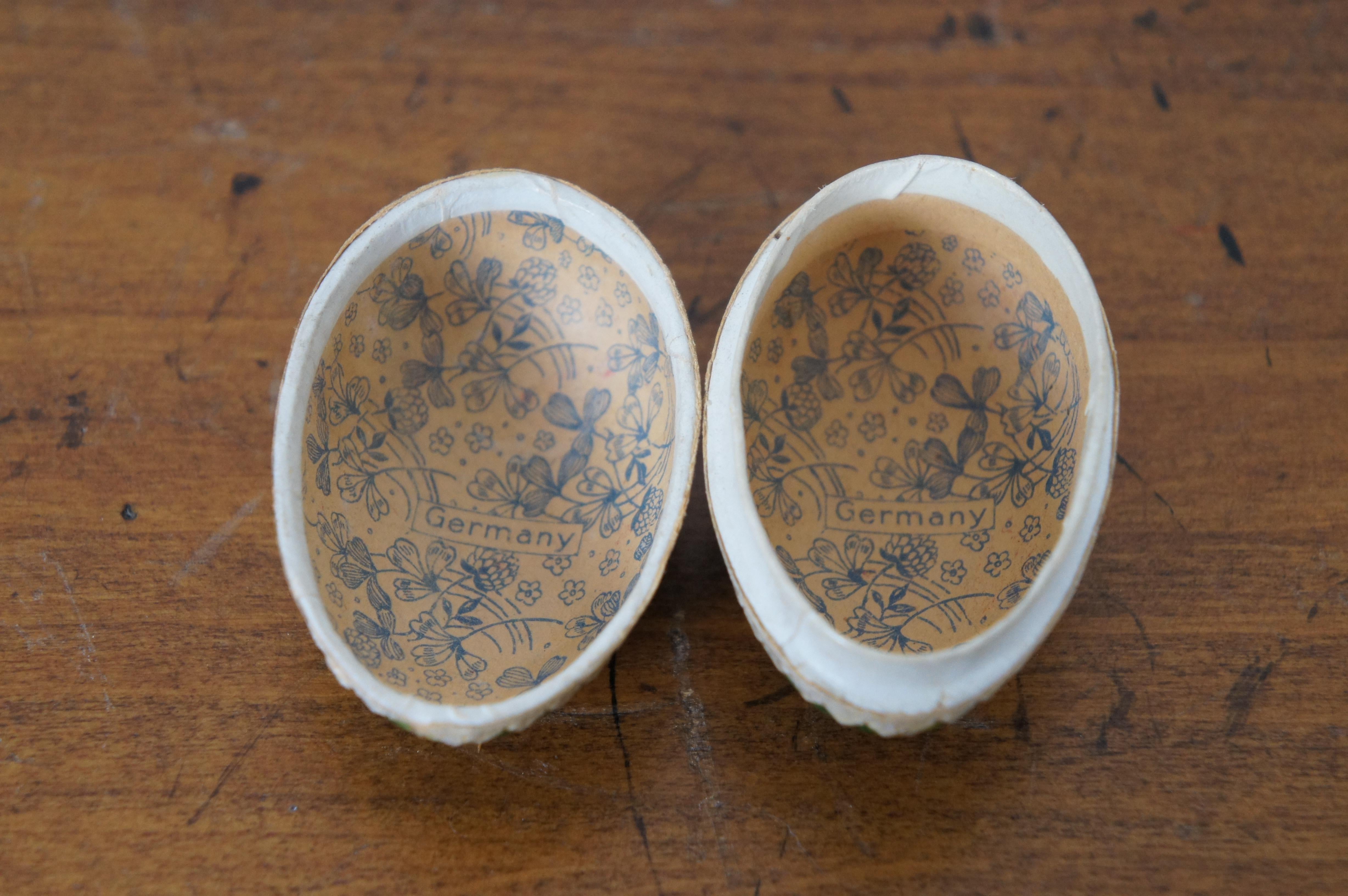 Antique Oeuf de Pâques en papier mâché contenant des bonbons Garçon jouant de la corne 2.25