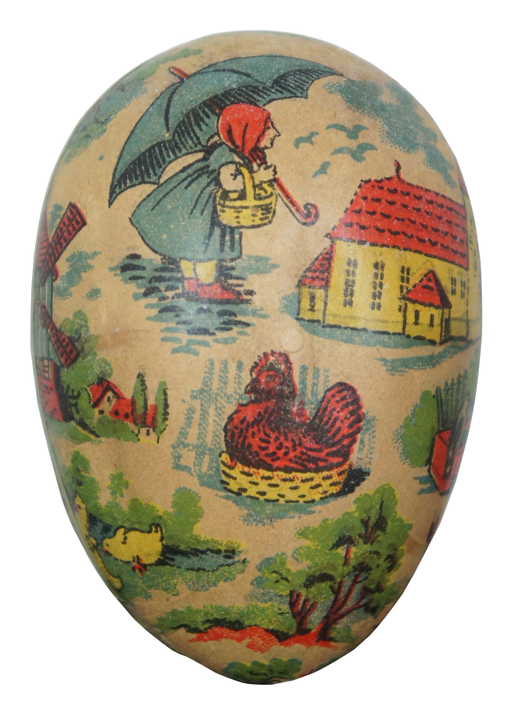 Antique German papier mâché Easter egg candy container, featuring an assortment of lithograph images in a storybook style including houses, a girl with an umbrella, a windmill, animals, a hen in a basket and an anthropomorphic rabbit. Measure: 3