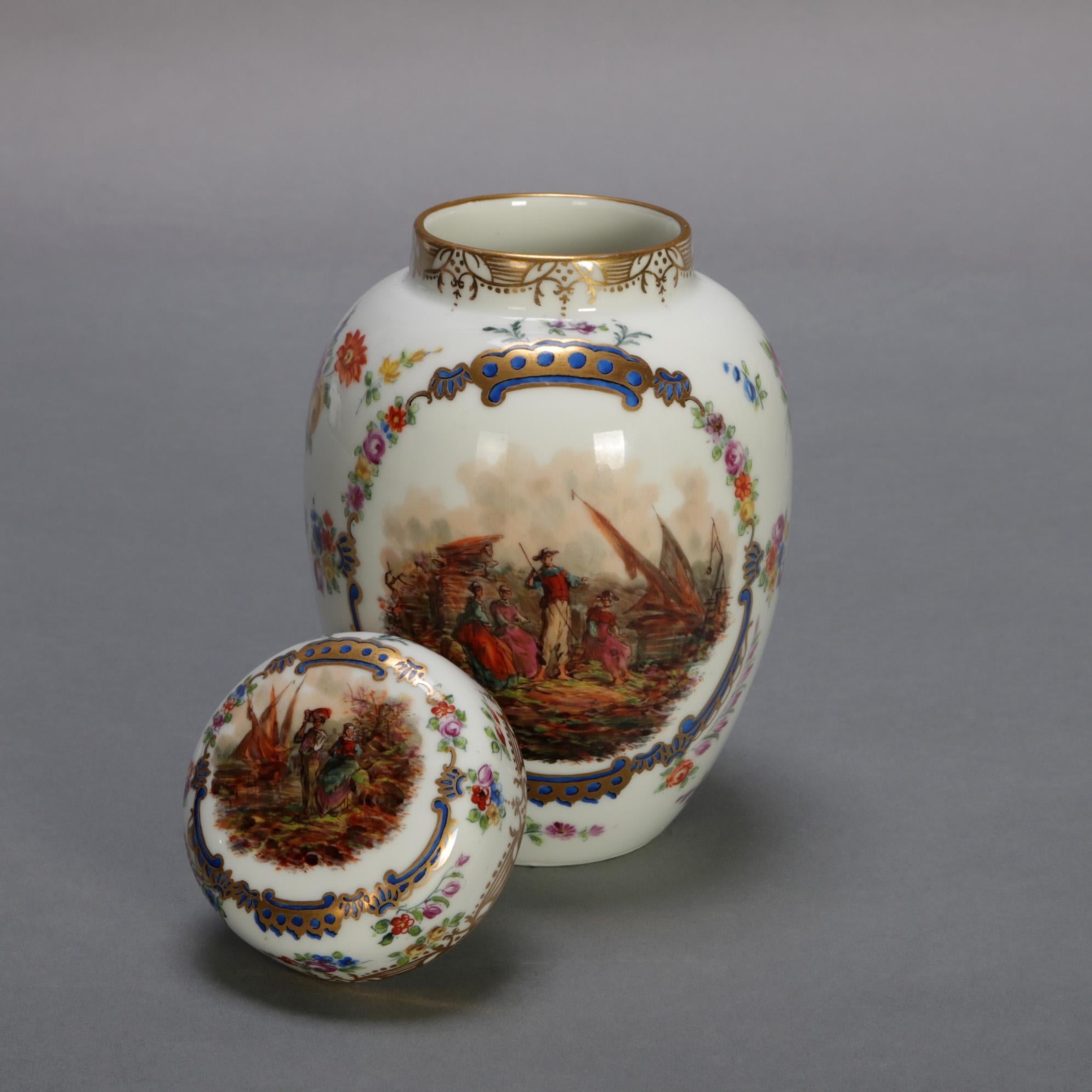 An antique German porcelain lidded tea caddy by Bro. Schone all Hottenstein features urn form with hand painted pictorial reserves of figures in countryside setting with all-over floral decoration and gilt highlights, maker's mark on base as