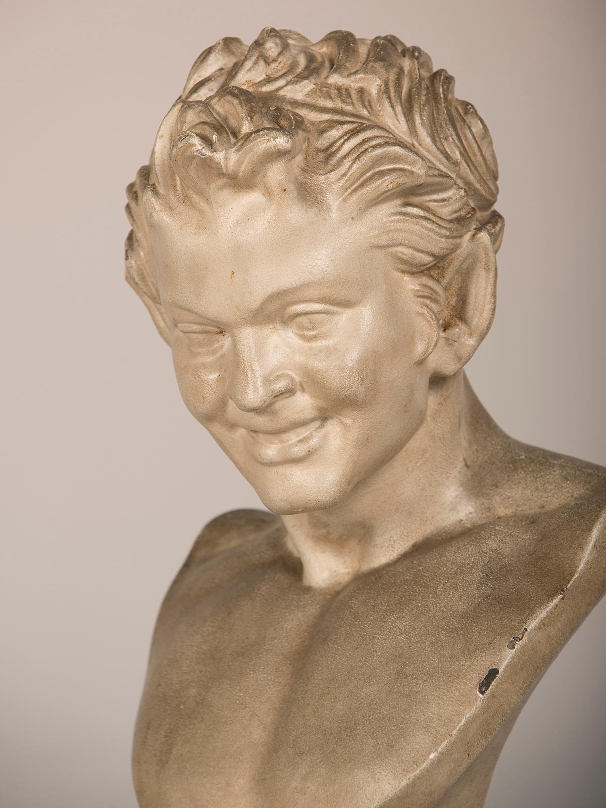 An antique German plaster bust of a character from 