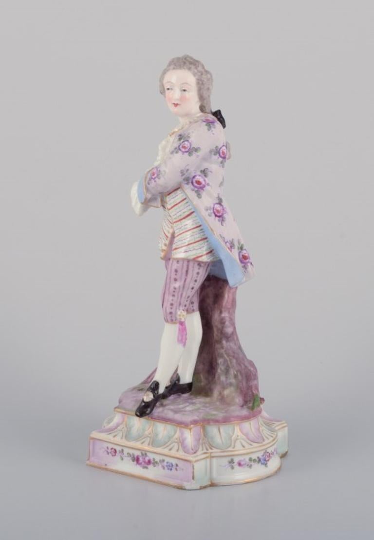 Rococo Antique German porcelain figurine of young man in fine clothes. For Sale