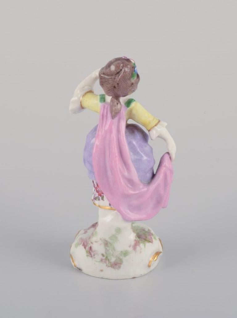 Hand-Painted Antique German porcelain figurine. Young woman in elegant attire.  For Sale
