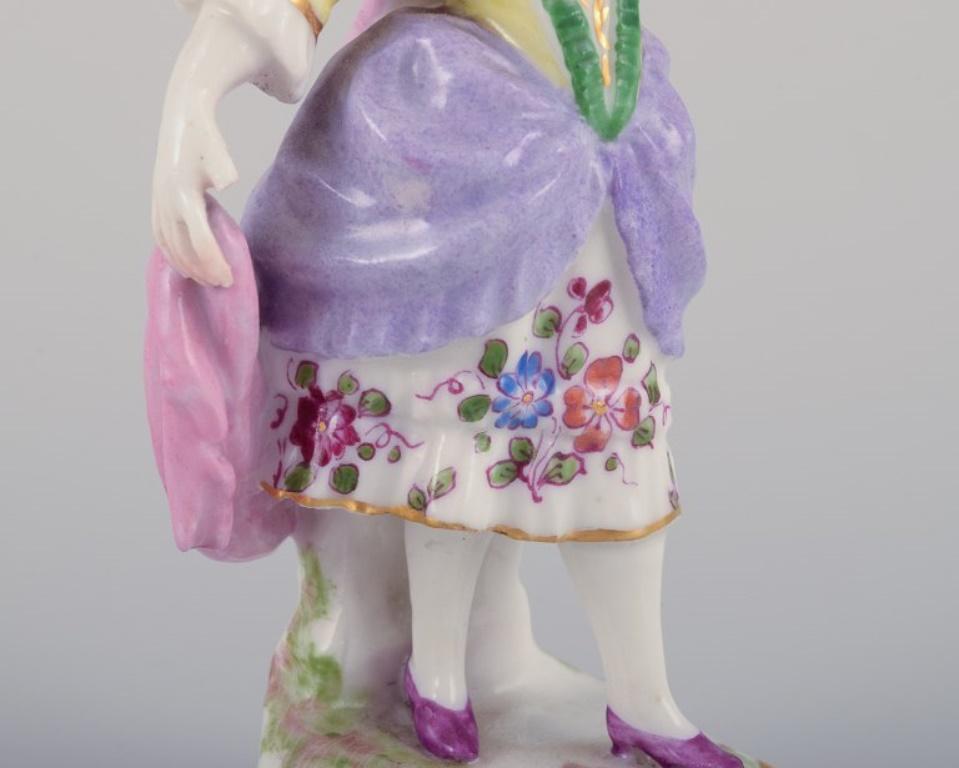 Porcelain Antique German porcelain figurine. Young woman in elegant attire.  For Sale