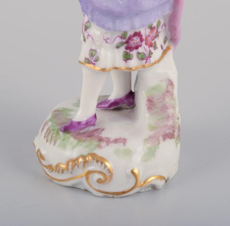 Antique German porcelain figurine. Young woman in elegant attire.  For Sale 1