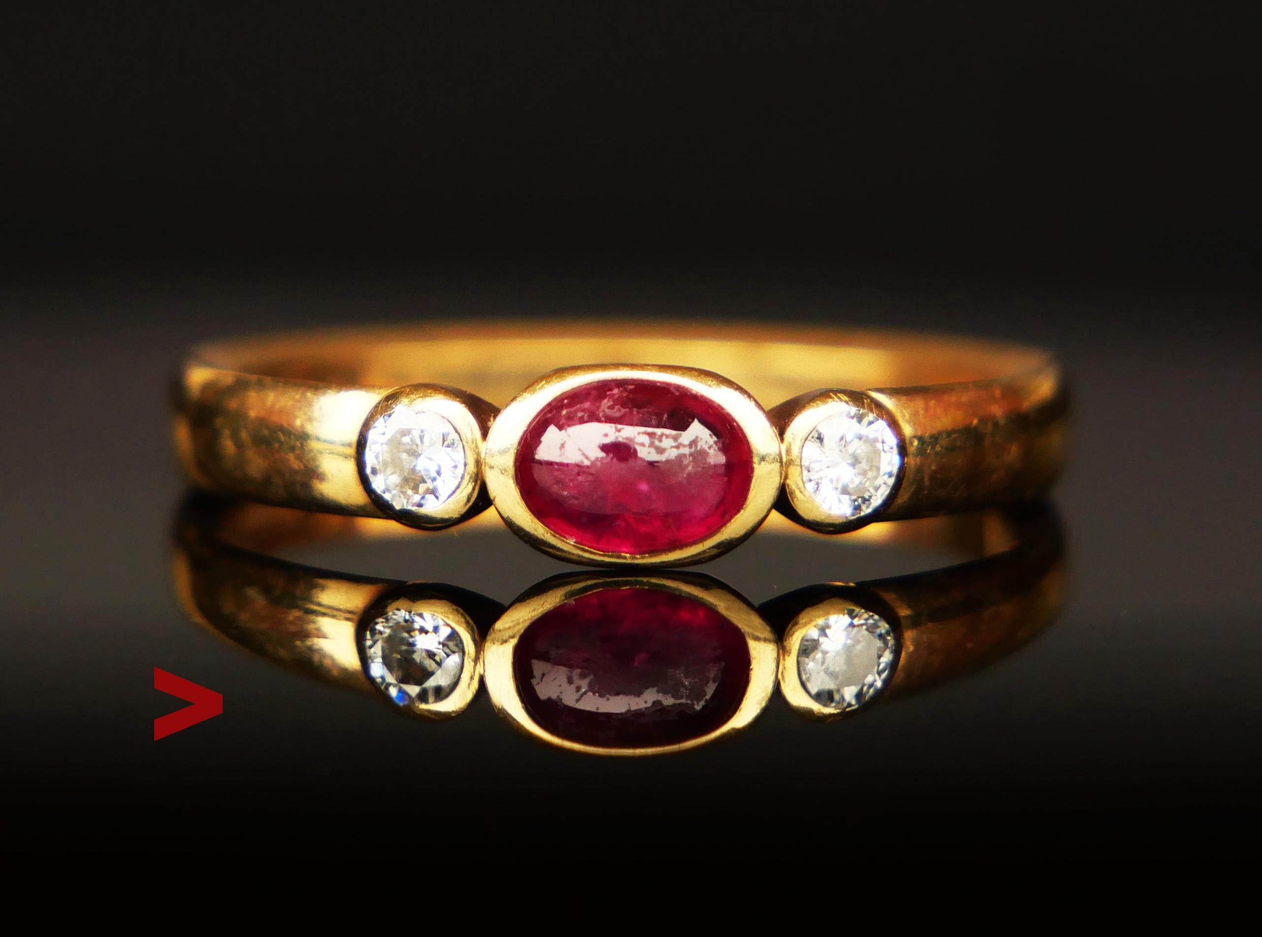 Beautiful Three Stones Ruby and Diamonds Ring hand-made in Germany ca. 1920s - 1930s.

Hallmarks of German maker, 585.

Cabochon cut natural Ruby 5.7 mm x 4.5 mm x 2.5 mm deep / ca.0.7 ct.

Two natural old European cut Diamonds Ø 2.5 mm x 1.5 mm