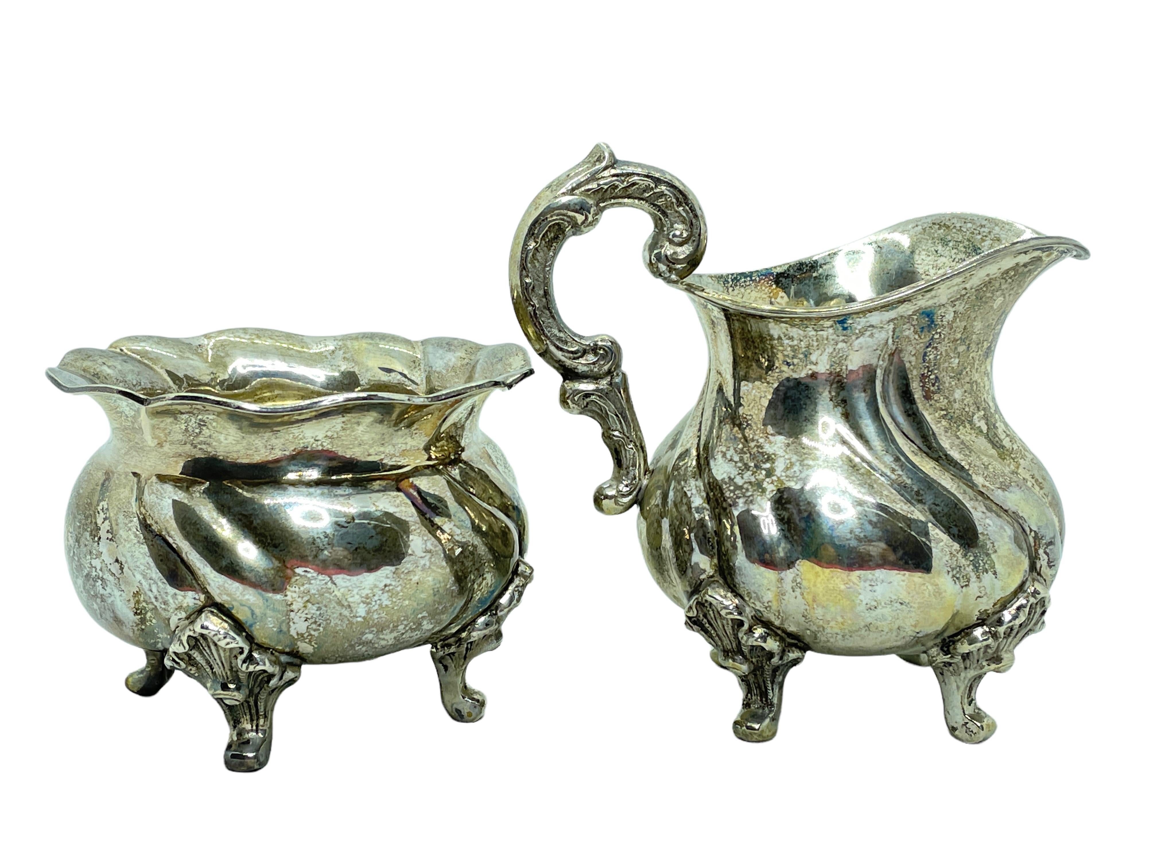 A beautiful Art Nouveau Sugar and Creamer set of two pieces. The items are made of silver, 0.800, they will make a nice addition to any table. Their total weight can be seen in the pictures in Gramms and OZ. They are marked with Crown and the silver
