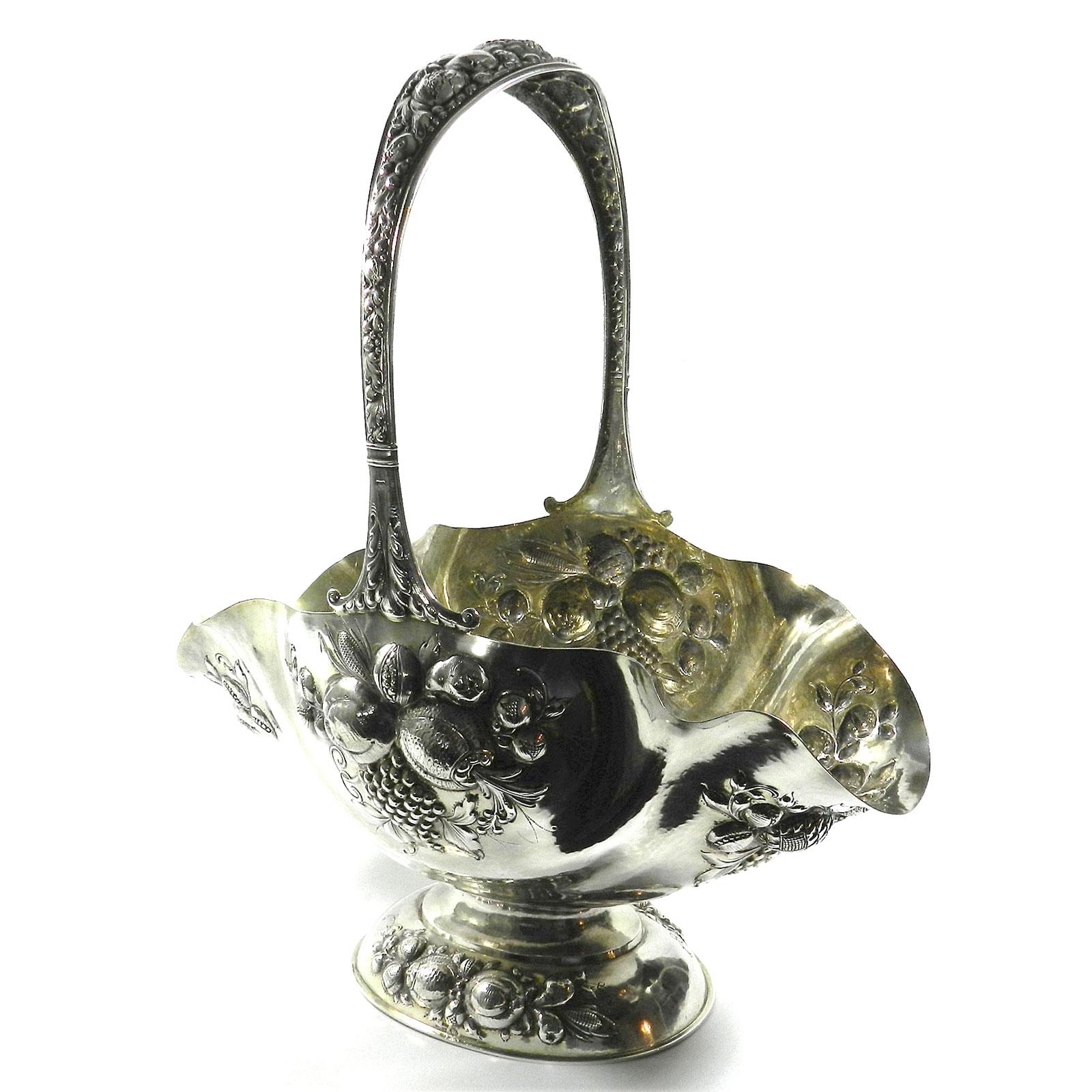Antique German Silver Basket Centerpiece Carl Weishaupt Munich circa 1900

Magnificent handle basket on a constricted foot,  the oval body all over richly decorated with chased fruit design. Overlapping, appropriately decorated handle. Gilded