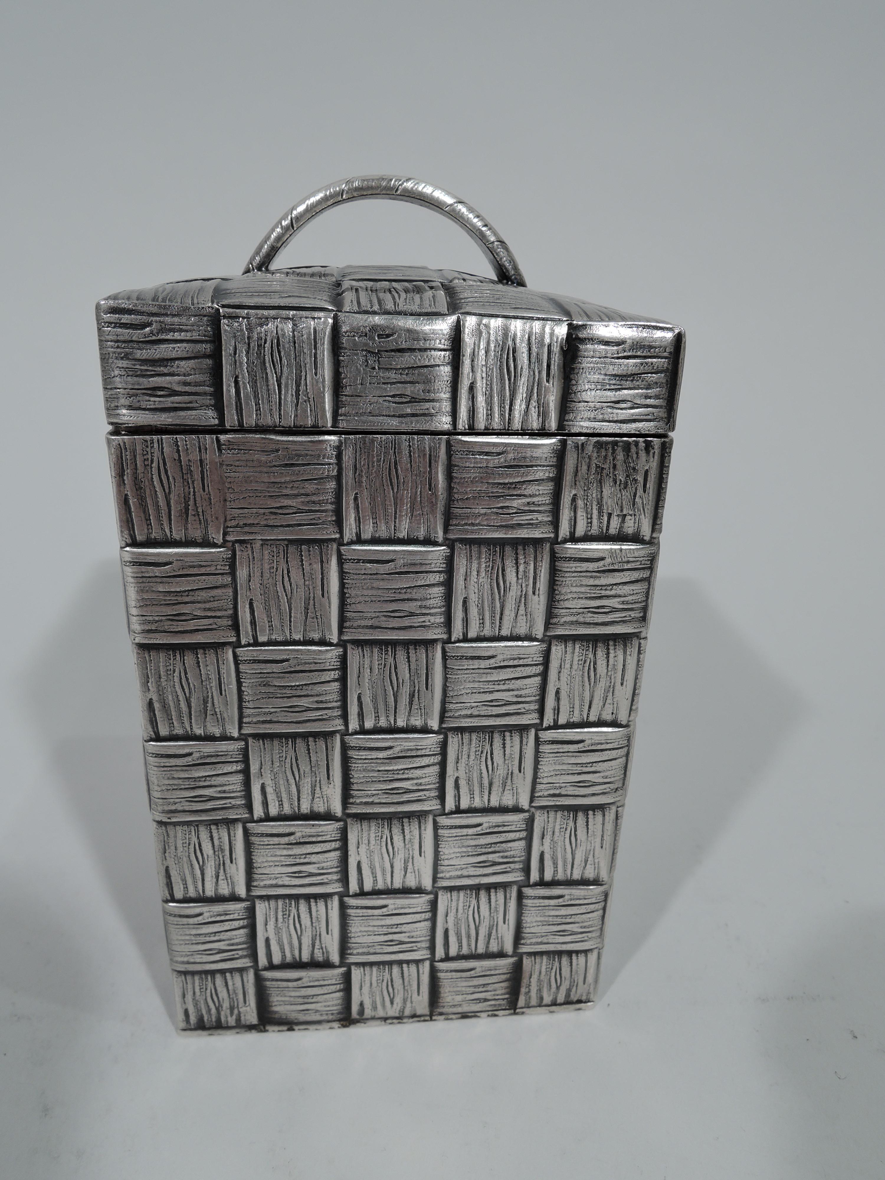 German 800 silver tea caddy, circa 1900. Rectangular with gently curved cover and loop handle. Realistic basket weave is perfect for a rarefied organic blend. Cover fits snugly to protect the precious leaves. Fully marked. Weight: 8 troy ounces.