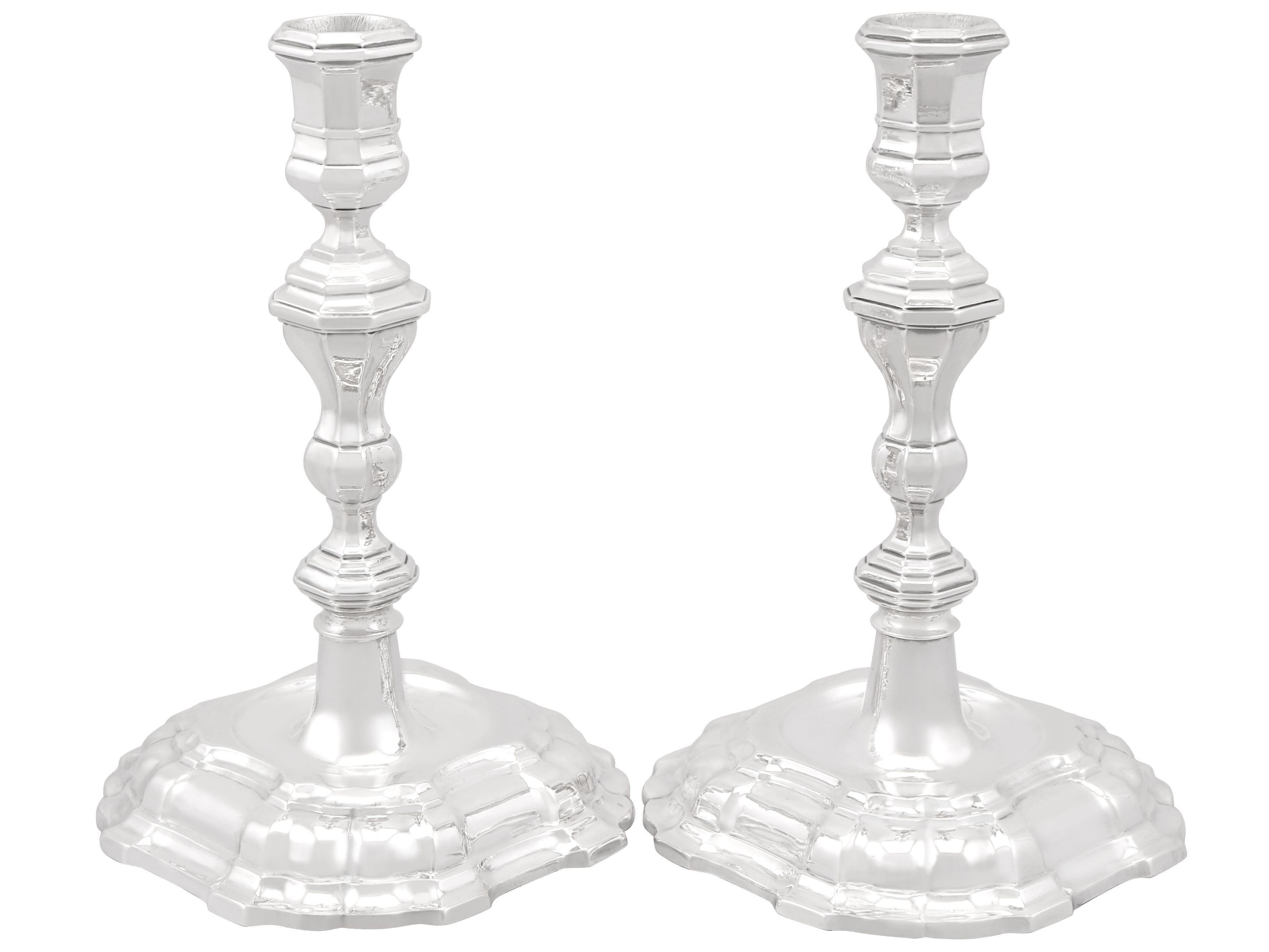An exceptional, fine and impressive pair of antique German cast silver candlesticks; an addition to our ornamental silverware collection.

These impressive antique German cast silver candlesticks have a panelled, shaped form.

The plain faceted
