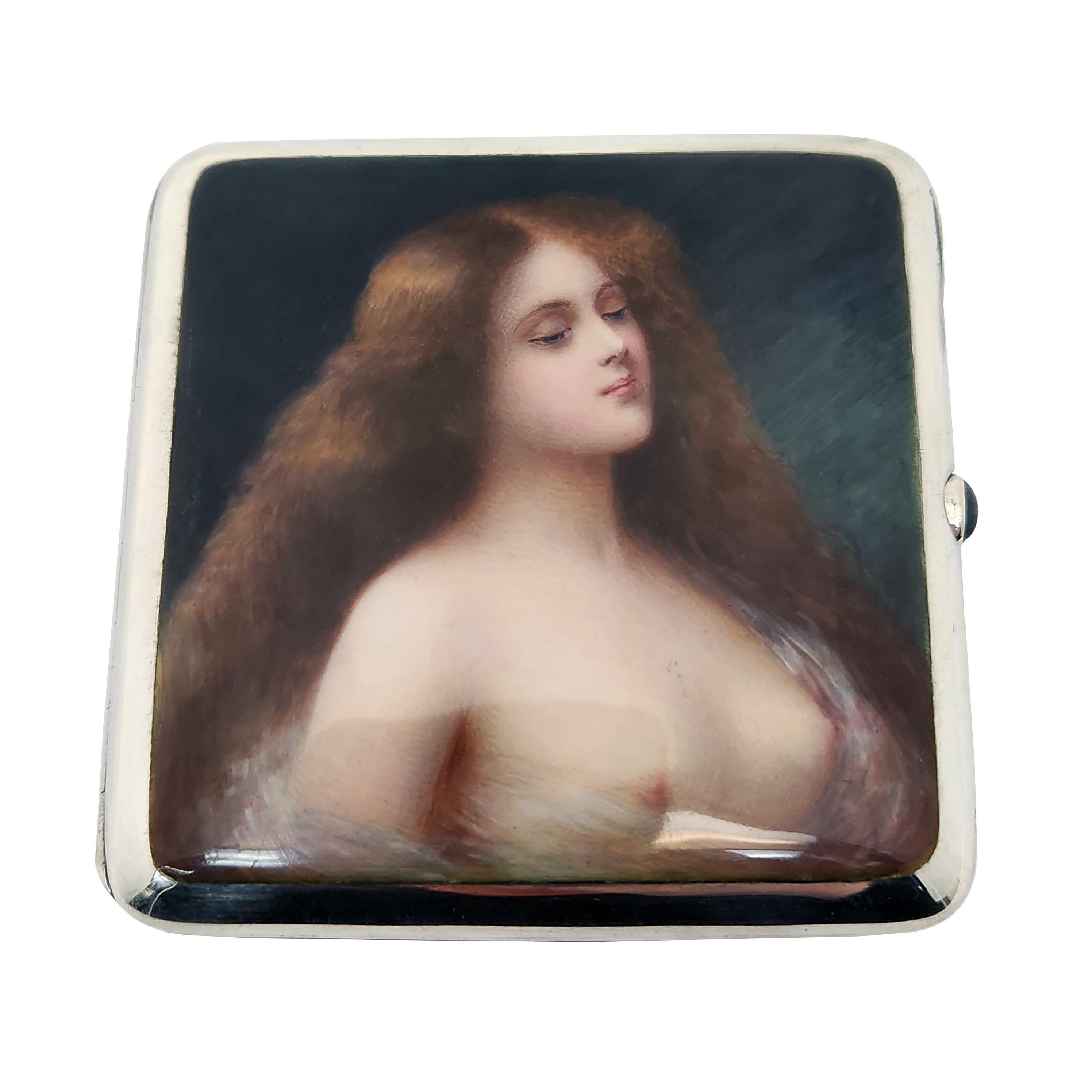 A lovely Antique German Silver & Enamel Erotic Cigarette Case with a beautiful Enamel Image of a Woman on the front cover. This Image is rendered in rich, deep colour with an impressive attention to detail. The Case has a blue cabochon stone inset