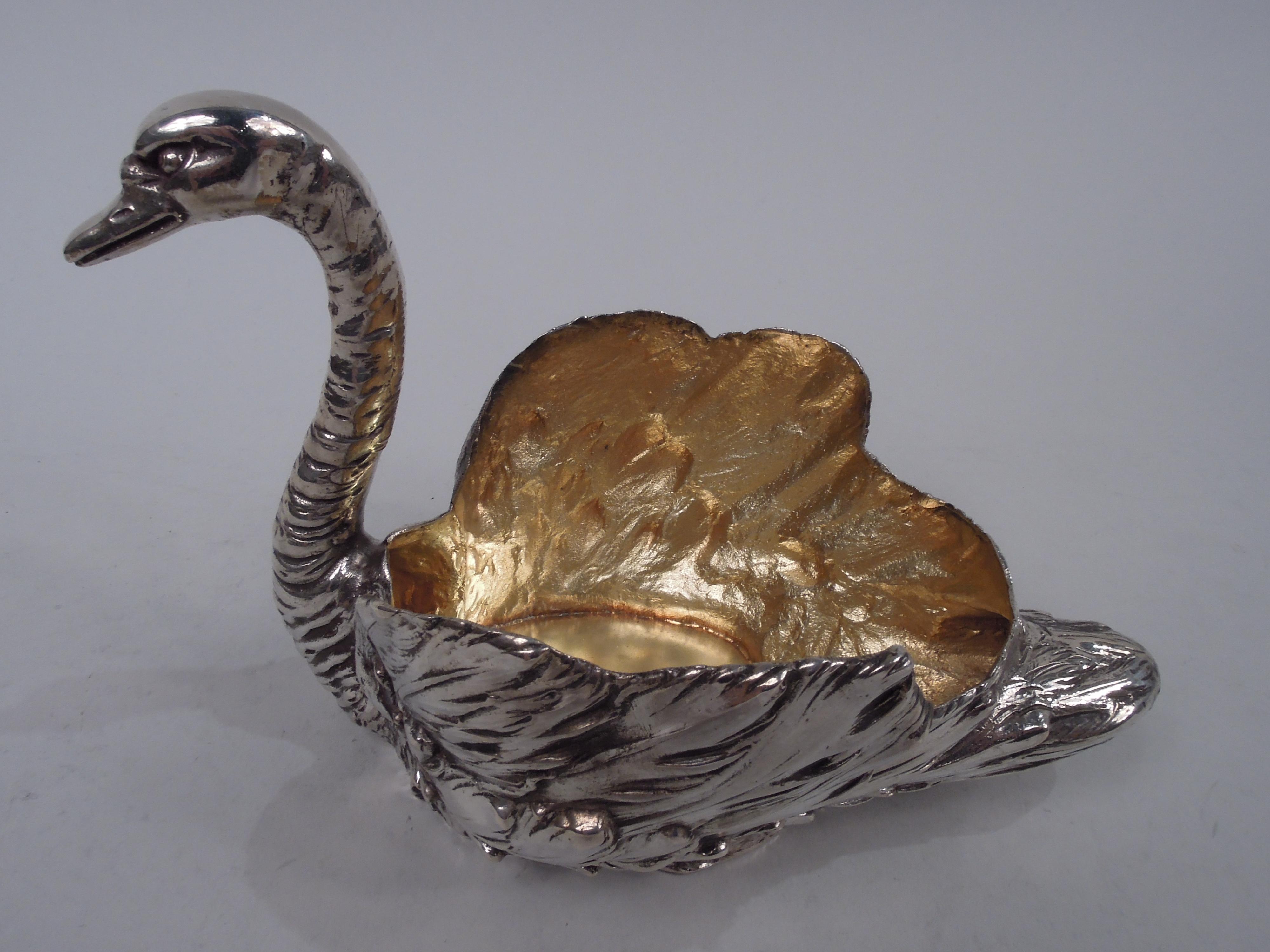 German 800 cast silver figural bird bowl, ca 1910. Swan with plumy wings and tail, and ringed s-scroll neck with graceful head terminating in long and closed bill. Hollow with gilt-washed interior for holding treats. Fully marked including maker’s