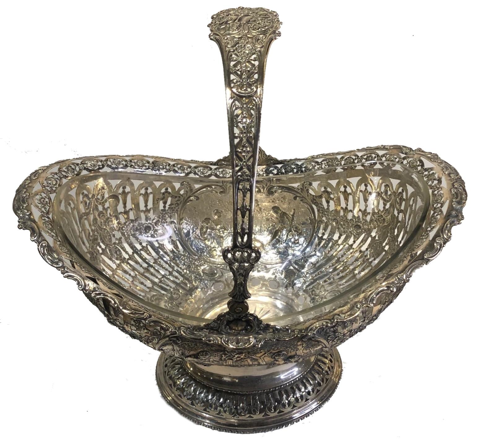 Antique
Silver Fruit Serving Basket w/ Glass Insert
Germany, Late XIX Century

DIMENSIONS
Height: 15.5 inches            Width: 15 inches            Depth: 10 inches

WEIGHT
44oz (1,383g)

ABOUT
Extremely meticulous silversmith workmanship and rich