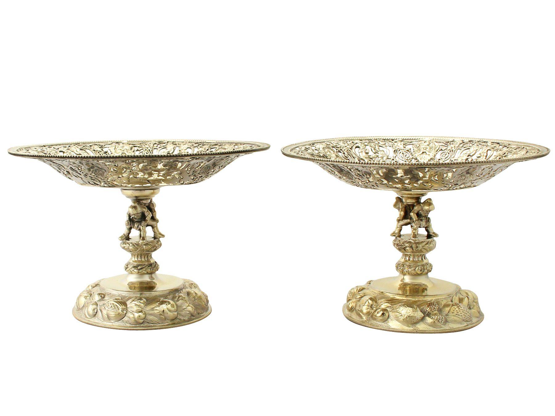 A magnificent, fine and impressive, pair of antique German silver tazzas or centerpieces; an addition to our continental silverware collection.

This magnificent antique German gilt silver tazzas or centerpieces has a circular rounded form onto a