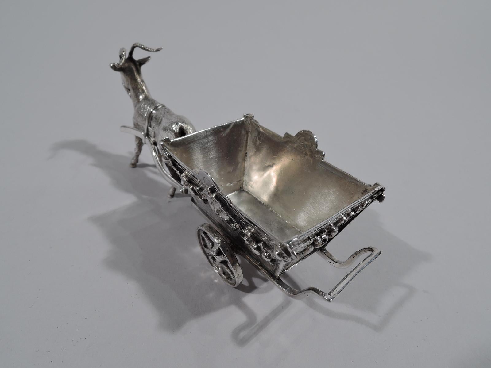 Antique German miniature silver country cart, circa 1900. Flower bedecked with tapering sides made of wood planks. Mounted to open frame that is harnessed to a steady goat. Sweet rural nostalgia. Wheels rotate. Marked. Weight: 2.5 troy ounces.