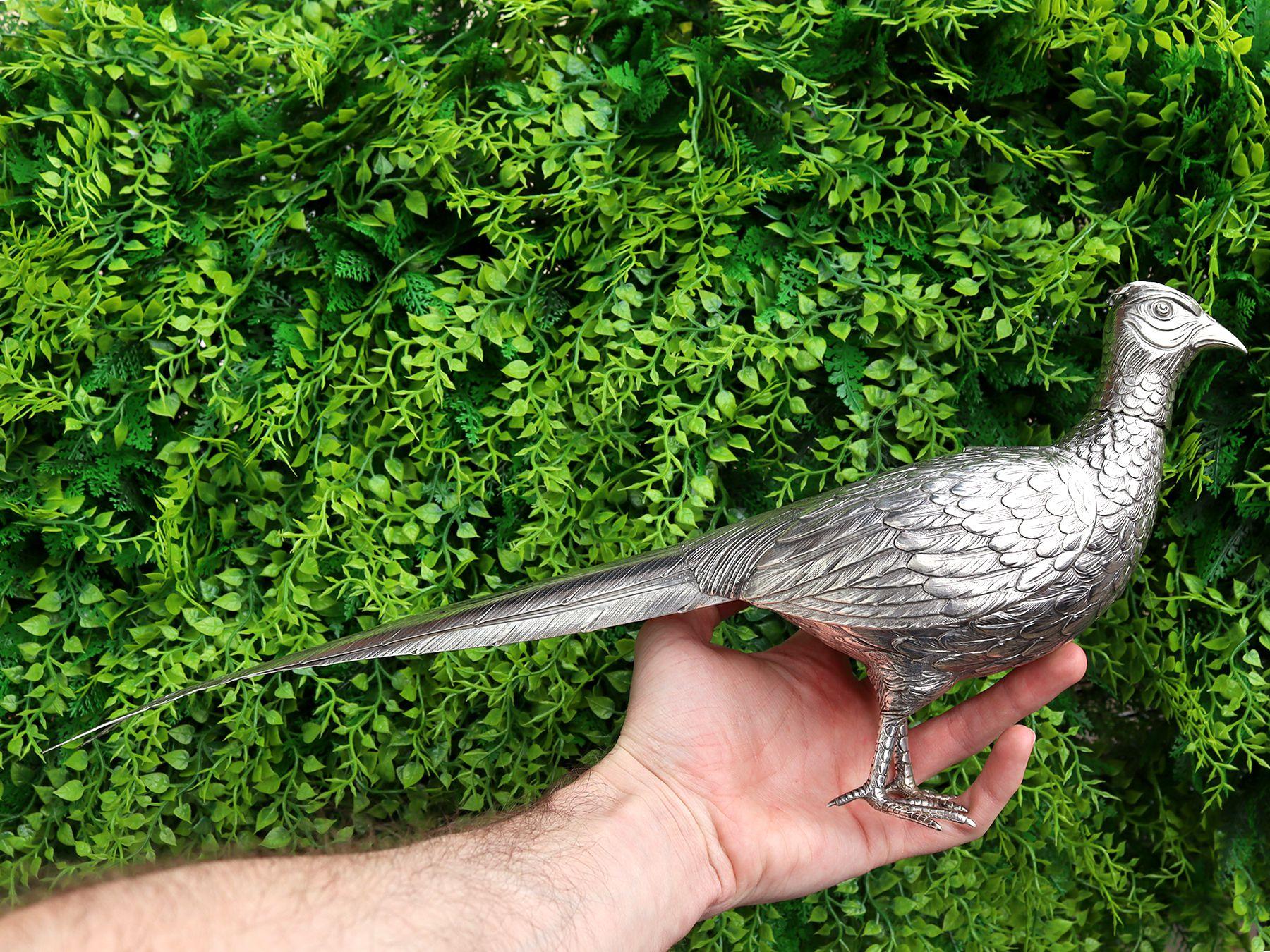 An exceptional, fine and impressive, large pair of antique German 800 standard silver pheasant sugar boxes; part of our continental ornamental silverware collection.

These fine antique German silver sugar boxes have been realistically modelled in