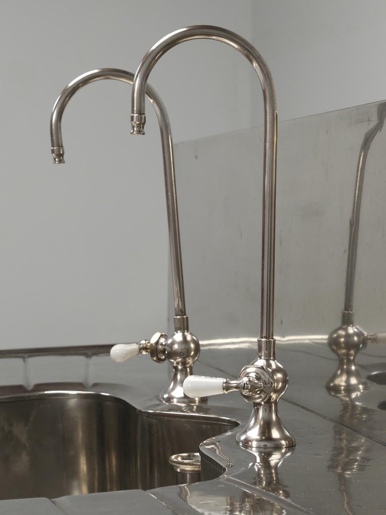 Antique German Silver Sink with Matching Backsplash and Faucets at