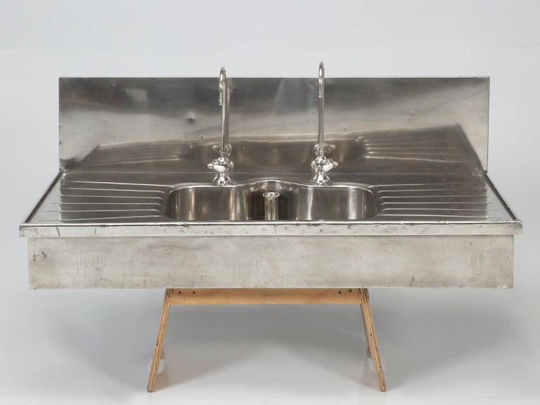 Antique German Silver Sink with Matching Backsplash and Faucets at