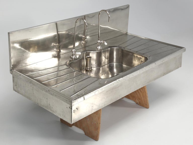Antique German Silver Sink with Matching Backsplash and Faucets at