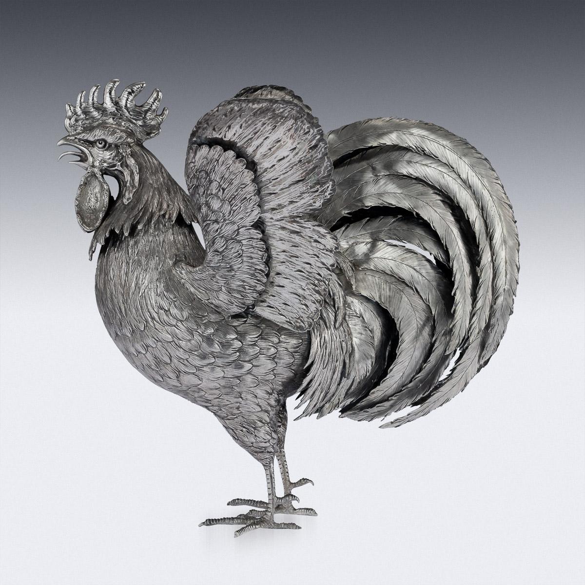 Antique early 20th century German solid silver ornamental, realistically modelled figure of a cockerel, of large size, with detachable head and spreading wings, heavy gauge and high quality of workmanship. The figure is beautifully engraved to the