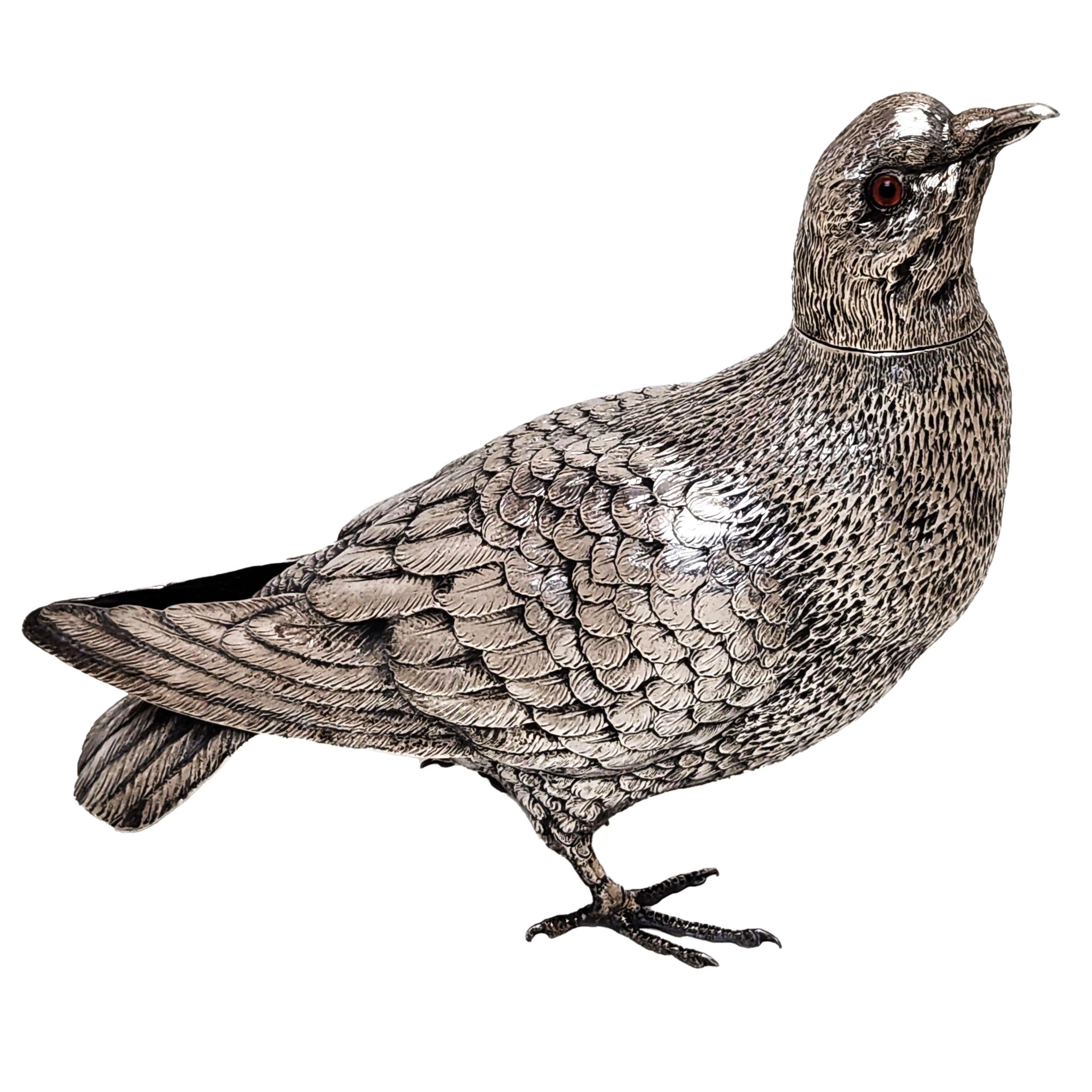 An impressive Antique German solid Silver Model of a Wood Pigeon. This Model Bird is of notable size and created with a lovely attention to detail. The Pigeon Figurine has inset glass eyes and a traditionally removable head.

Made in Germany in c.