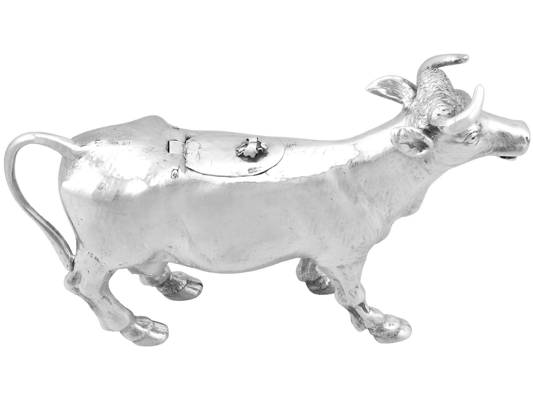 An exceptional, fine and impressive, large antique German sterling silver cow creamer made by B. Neresheimer & Söhne; an addition to our silverware collection

This exceptional and large antique cast sterling silver creamer has been realistically