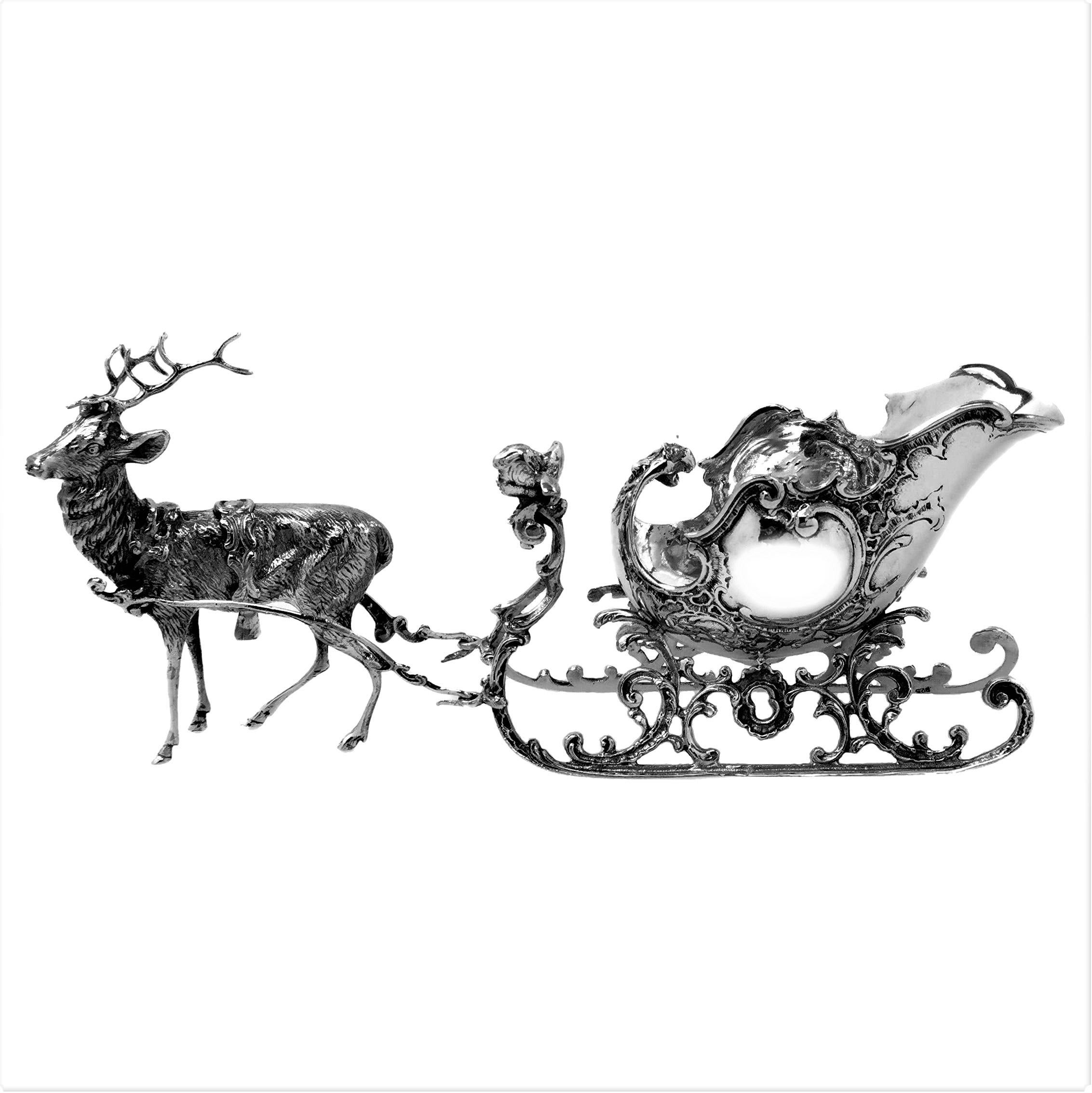 silver metal reindeer and sleigh