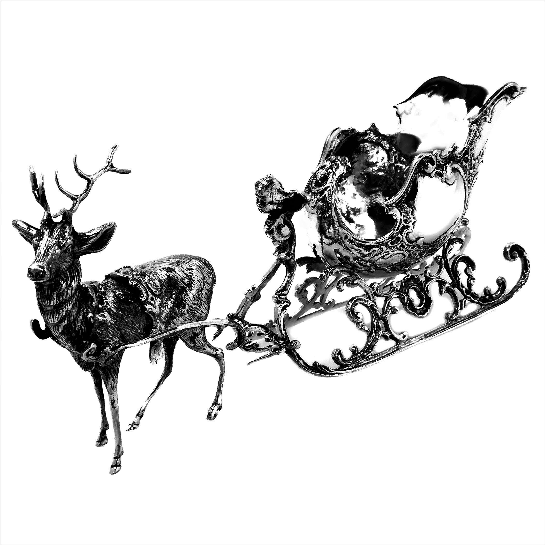 A lovely Antique German Silver model of a Reindeer pulling a Sleigh. The Reindeer is created with a lovely attention to detail and is pulling an empty sleigh embellished with pretty floral chased details.

Made in Germany, in c. 1910

Approx. Weight