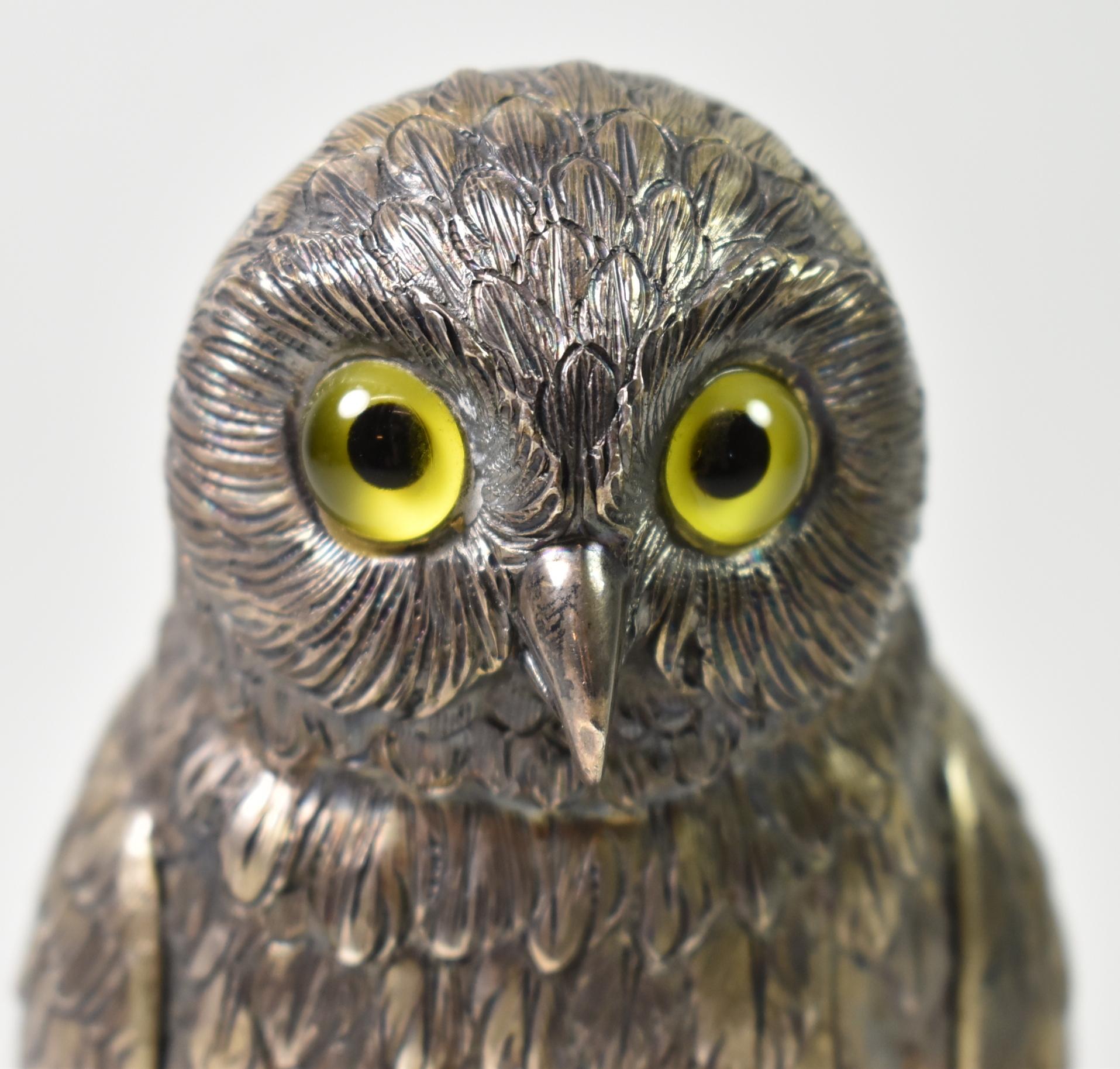 Antique German Sterling silver owl sculpture with glass eyes from the early 1900's. Cast table ornament with fine detailing. Marked Sterling, 925, Germany on the foot. 6 3/4