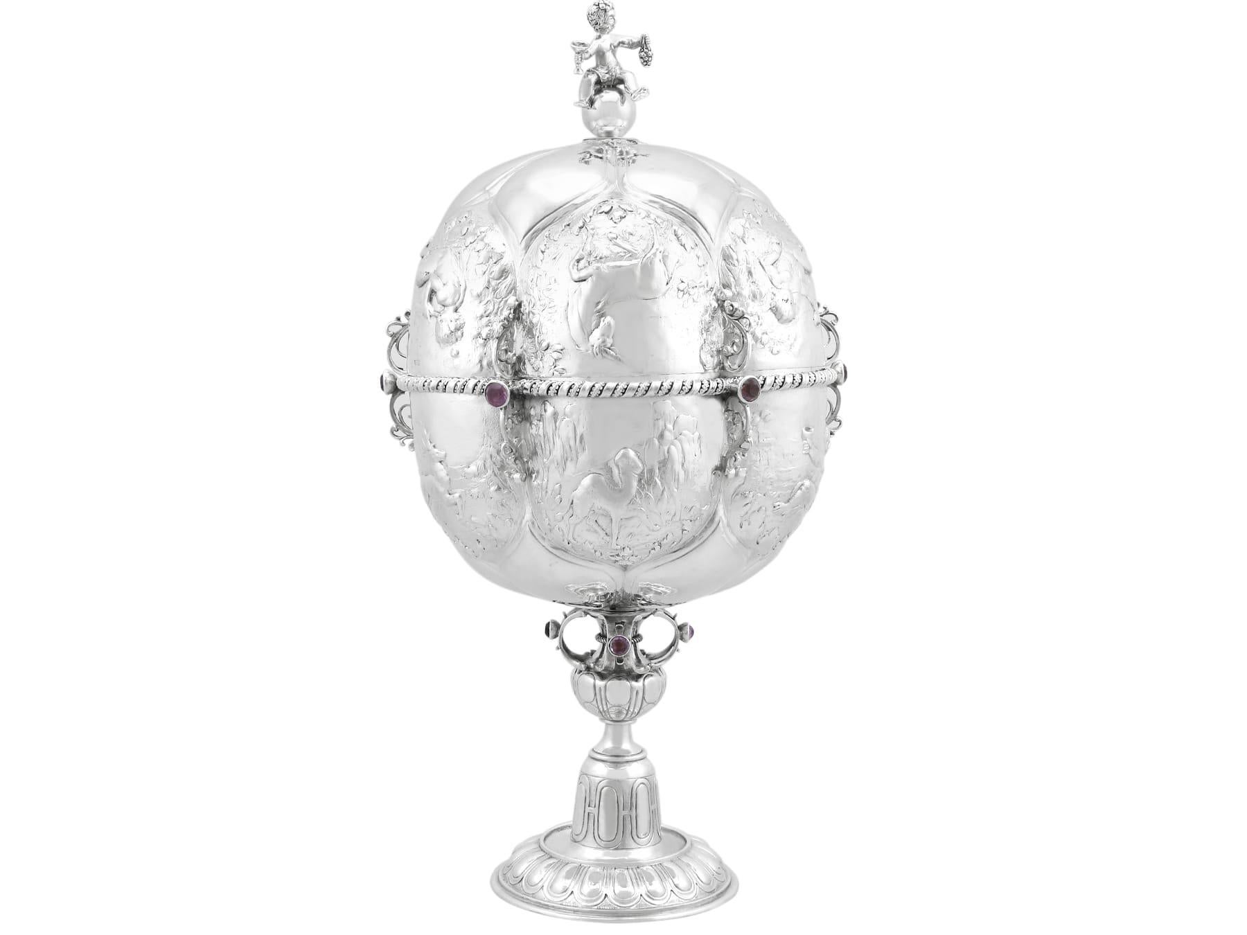 An exceptional, fine and impressive antique German sterling silver cup and cover; an addition to our antique presentation silverware collection.

This exceptional antique German sterling silver cup & cover has a bulbous circular shaped form onto a