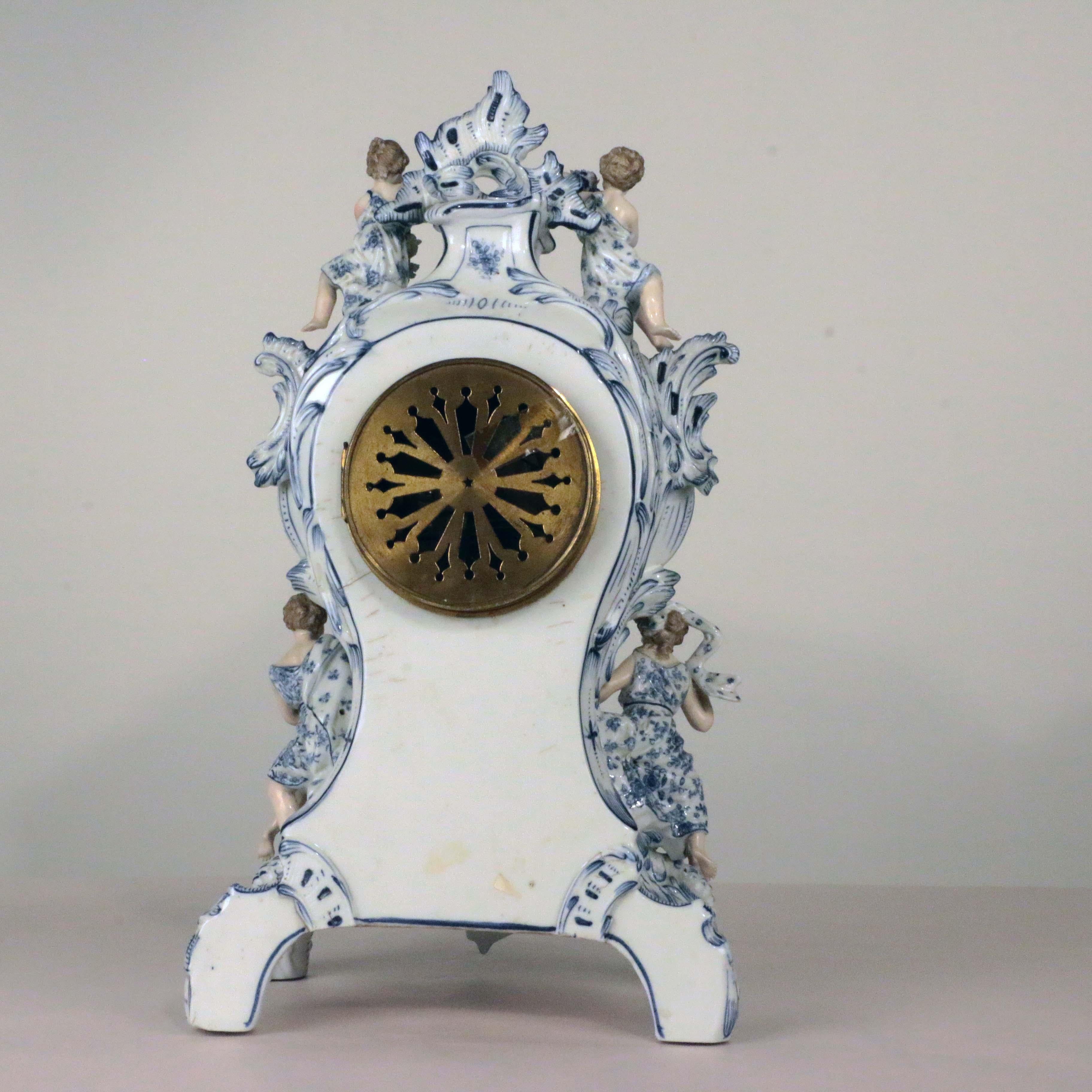 Molded Antique German Three Piece Porcelain Clock Garniture For Sale
