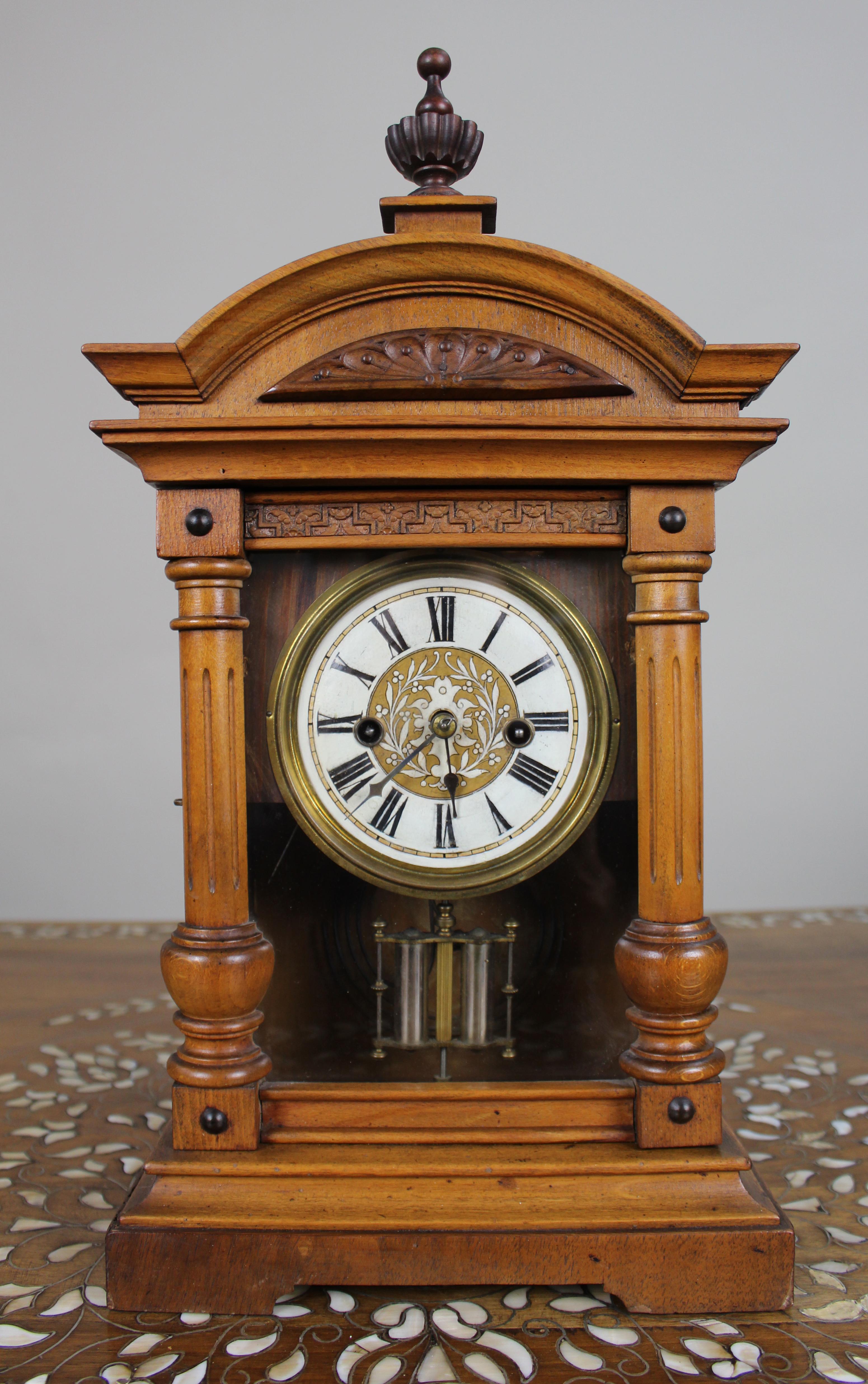 Antique German Württemberg Mantel Clock, c.1890

A late 19th century German mantel clock, originating from Württemberg.

The architectural pine case is of attractive design, with a shaped pediment surmounted by an urn finial, carved foliate panel,