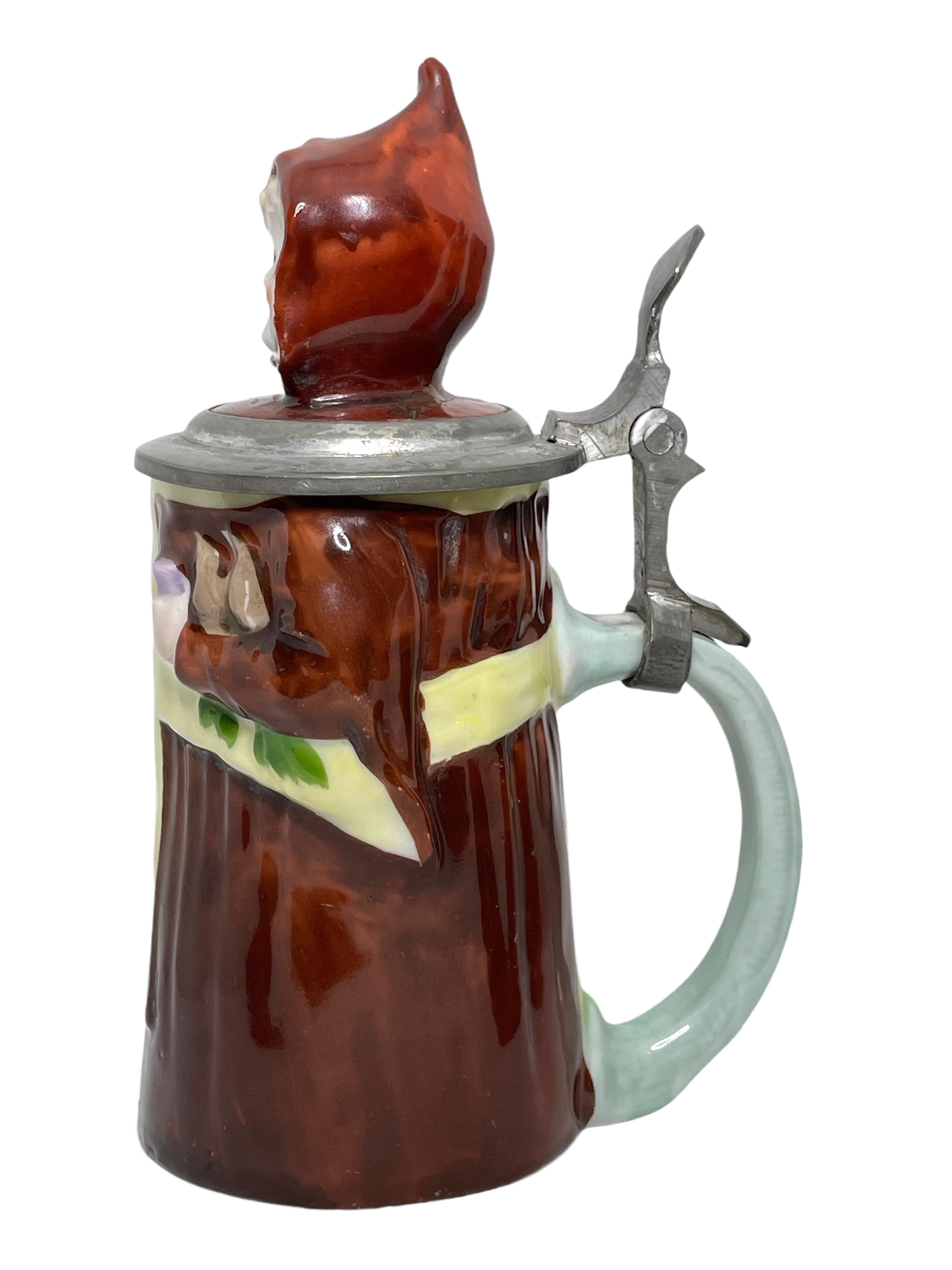 A gorgeous Character Beer Stein - Munich Child. This character beer stein has been made in Germany circa 1900s by E. Bohne, Thuringia Germany. Absolutely gorgeous piece hand painted and still in great condition. Lid works properly.