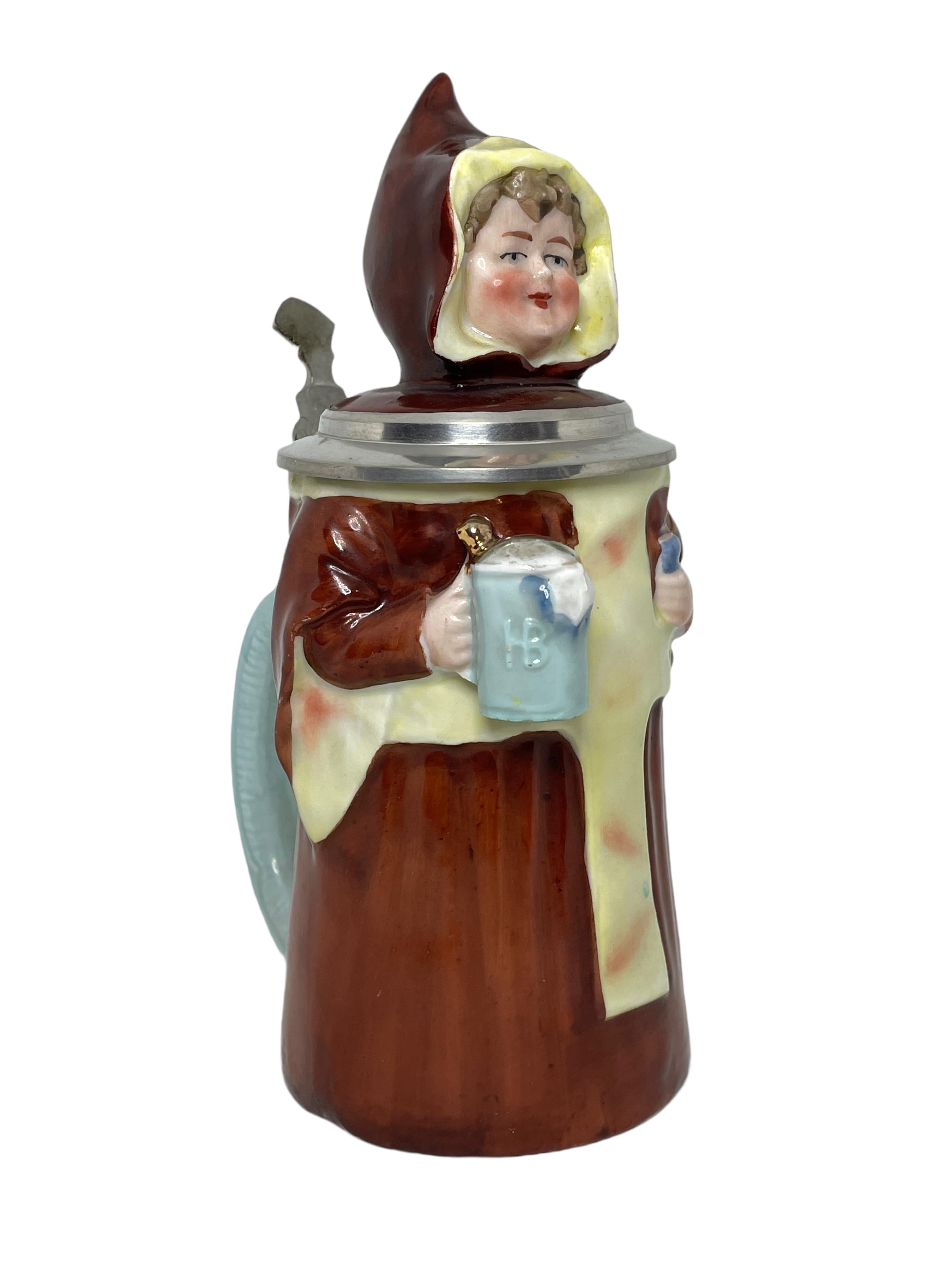 A gorgeous Character Beer Stein - Munich Child. This character beer stein has been made in Germany circa 1900s by E. Bohne, Thuringia Germany. Absolutely gorgeous piece hand painted and still in great condition. Lid works properly.