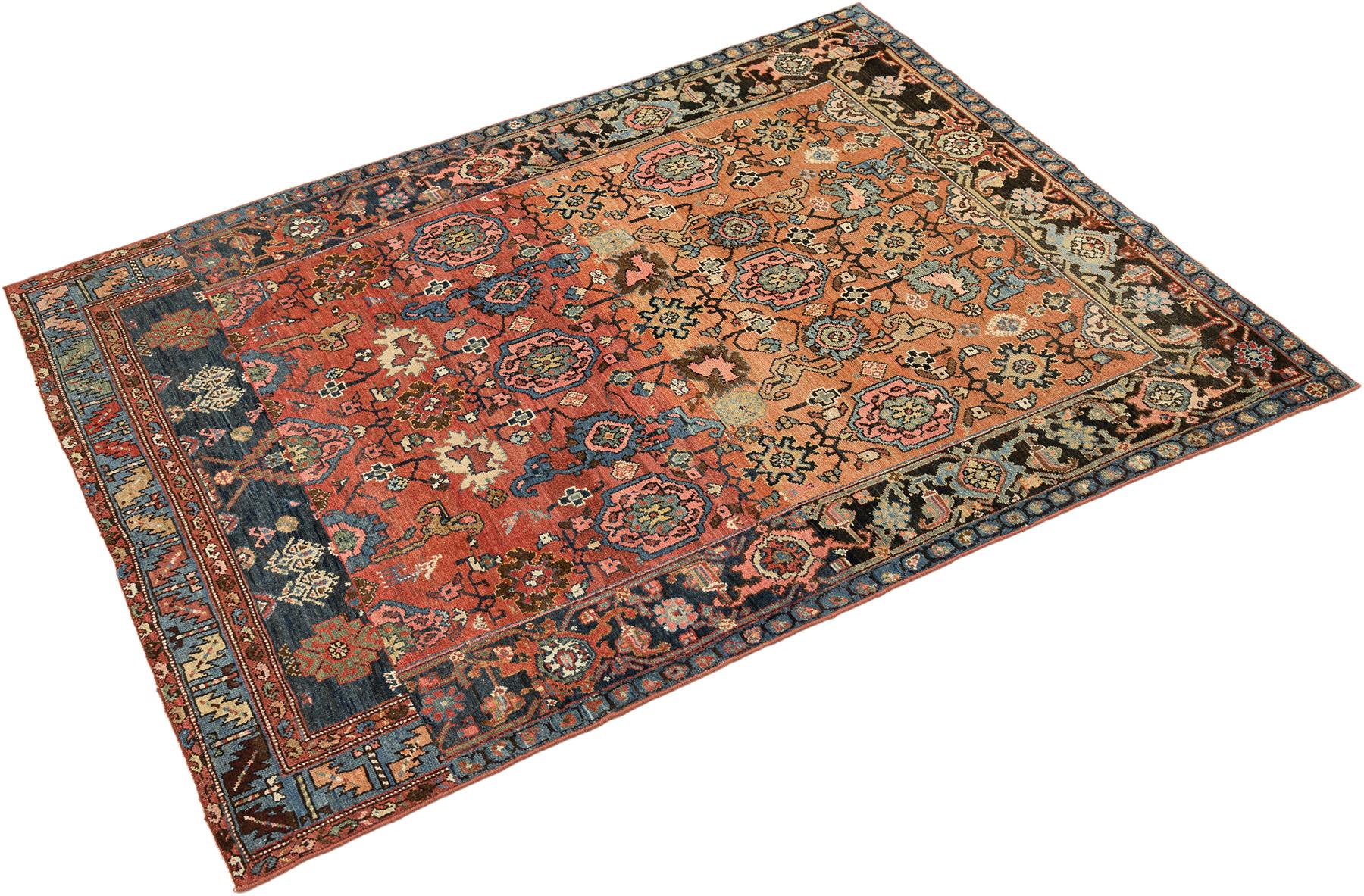 Hand-knotted Gharajeh rug, woven in Northwest Iran circa 1900.

This antique Gharajeh rug displays a striking geometric composition. The coral field is framed by deep navy borders with blue and ivory accents, creating a vivid yet harmonious design