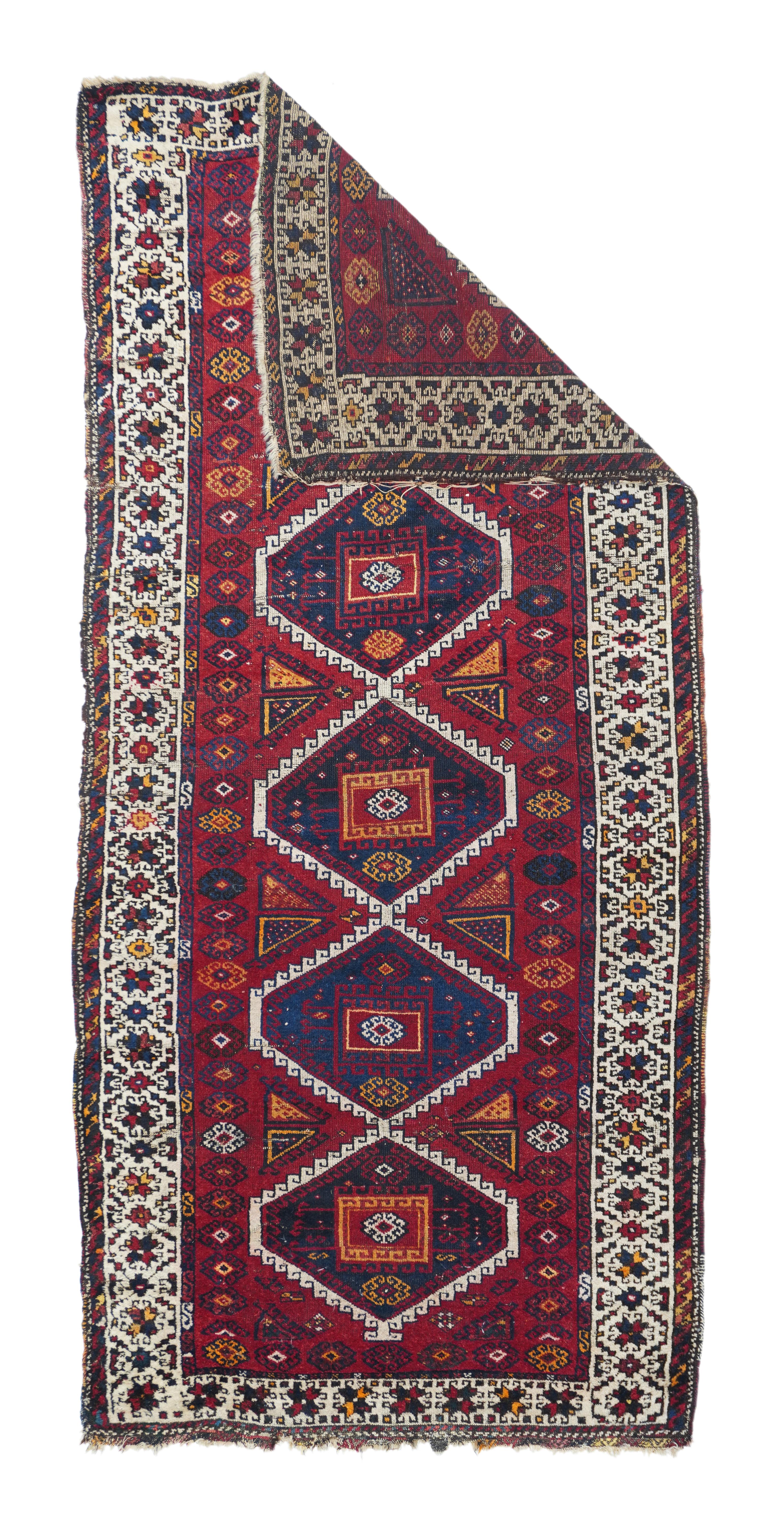 Antique Ghashgaie Rug 4'3'' x 9'5''. Not Persian, but from the Kurdish Yuruk tribes of eastern Anatolia. The characteristic orange-red field displays hooked ecru pole medallion of five dark blue and red joined hexagons, with split triangular fillers