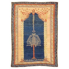 Ancien tapis Ghiordes bleu champ