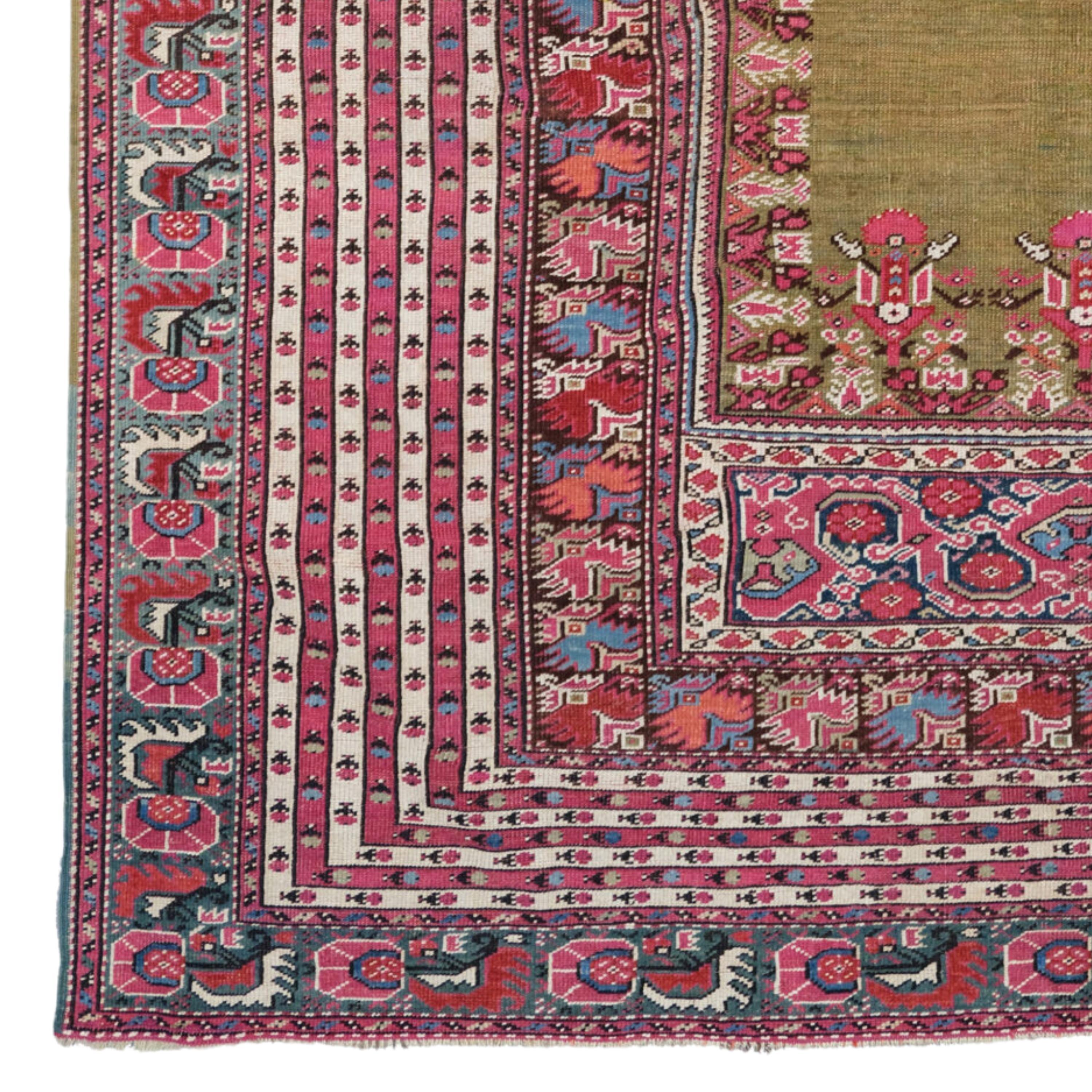 Antique Ghiordes Prayer Rug | Anatolian Rugs
Antique Ghiordes Prayer Rug Circa 1840’s
Size : 155×215 cm (61x84,6 In)

The rug is beautifully drawn with superb pastel colours through out especially the soft green in the field. The multiple stripe