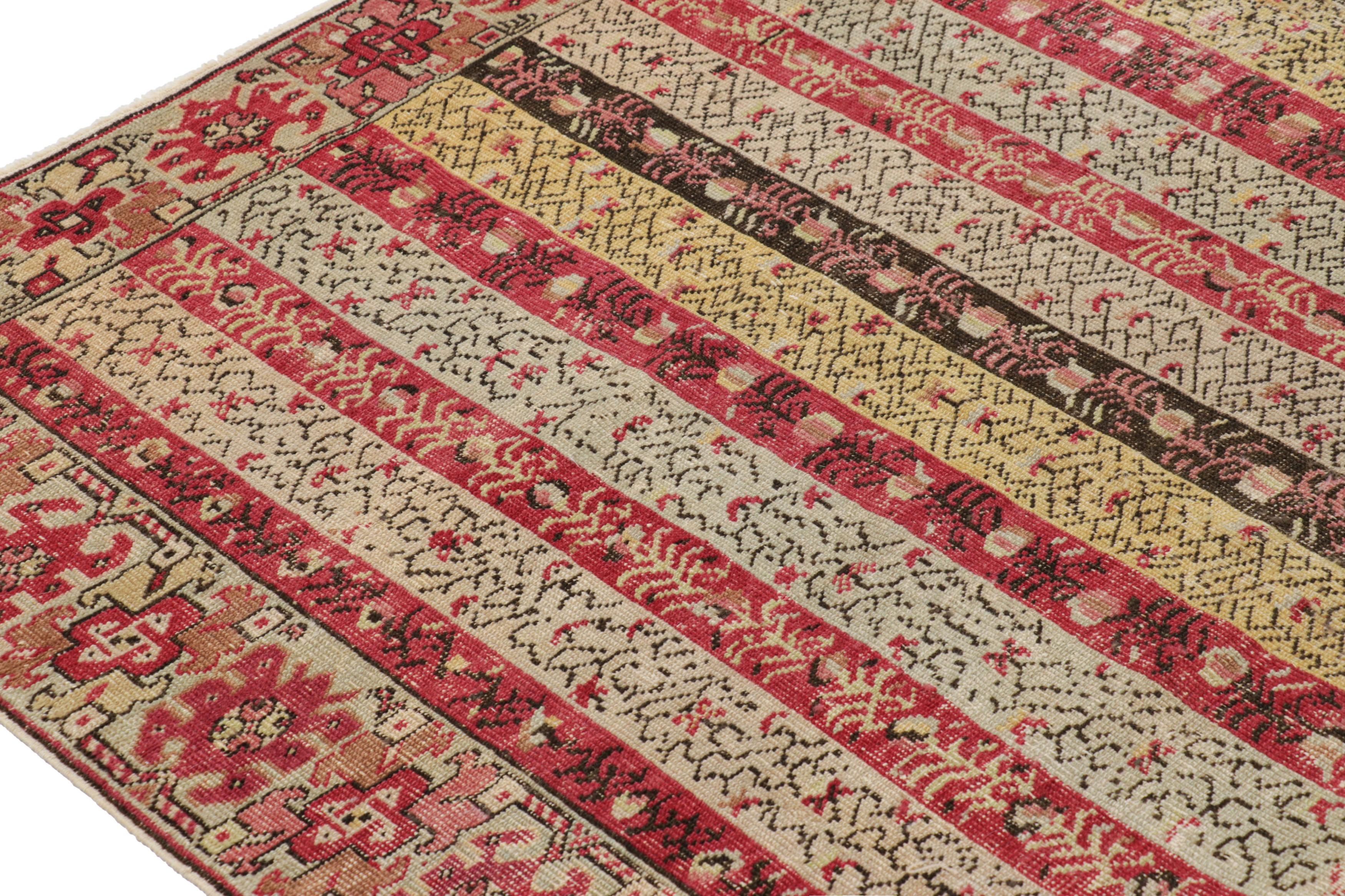 Turco Antico tappeto Ghiordes con strisce policrome e motivi floreali - Rug & Kilim in vendita