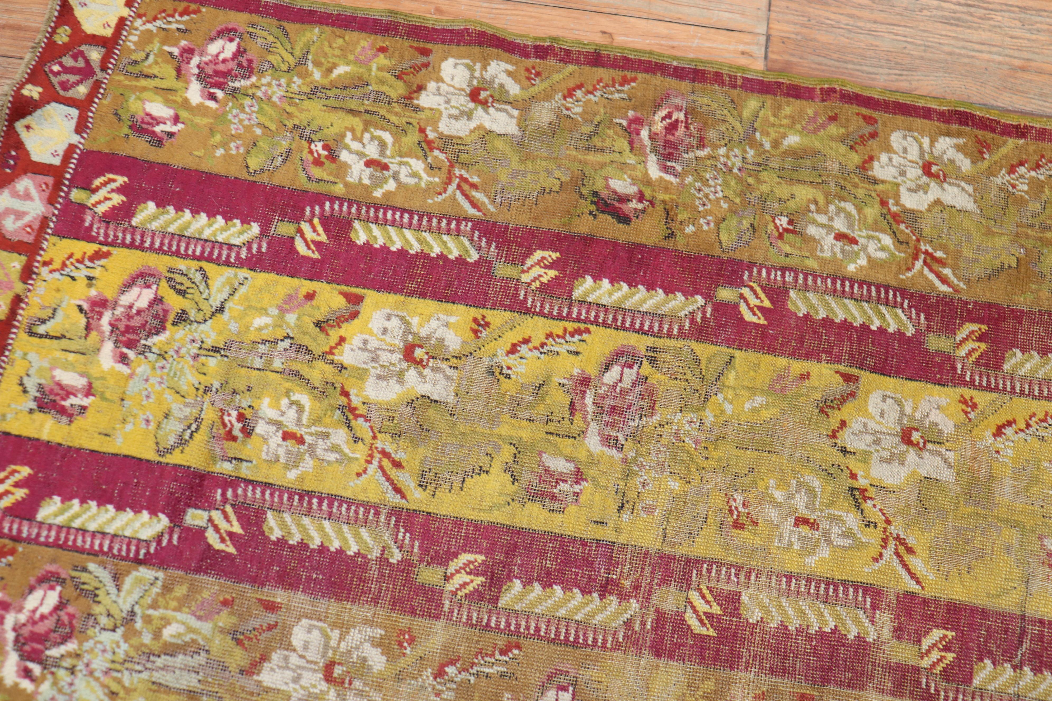 Antique Ghiordes Small Floral Runner In Fair Condition For Sale In New York, NY