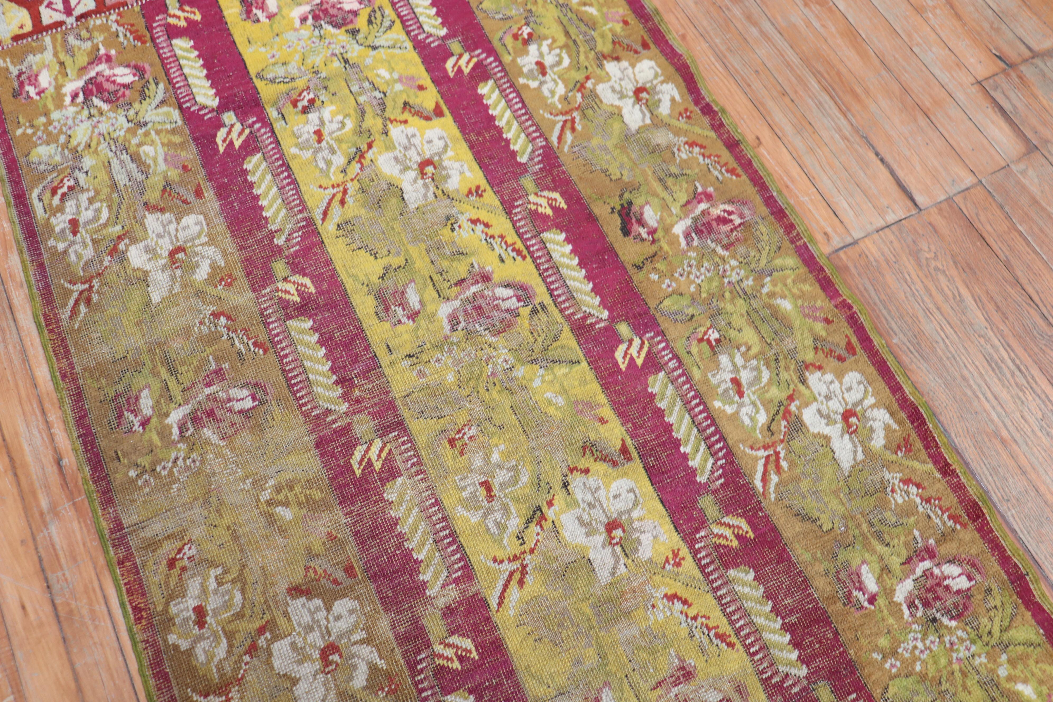 19th Century Antique Ghiordes Small Floral Runner For Sale