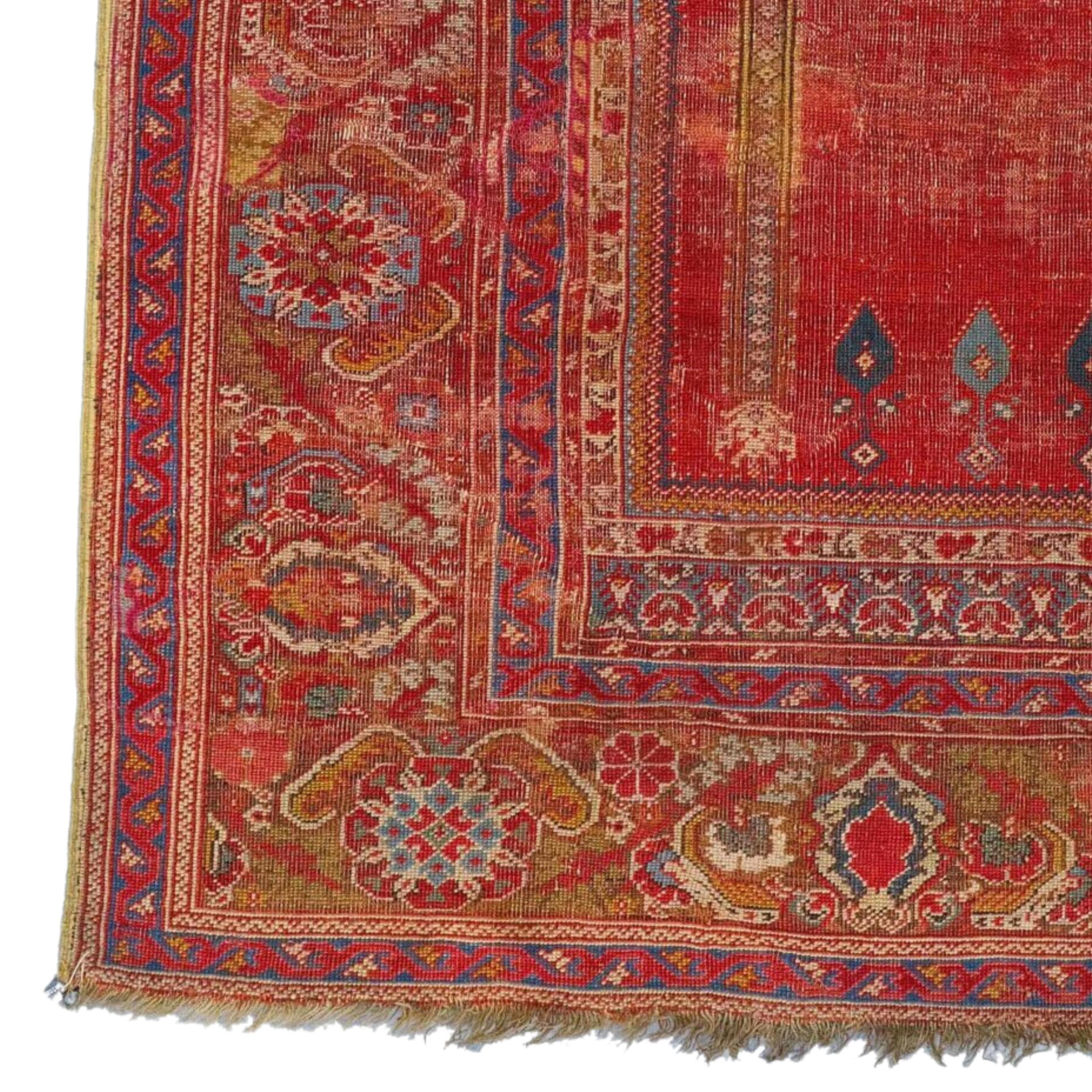 18th Century Anatolian Ghordes Rug Size 118 x 165 cm (3,87 x 5,41 ft)

With ‘floating’ columns and an enlarged ‘mosque lamp’ motif dominating the red field of the mihrab, this so-called ‘Basra Ghiordes ‘ prayer rug belongs to a subgroup of 18th