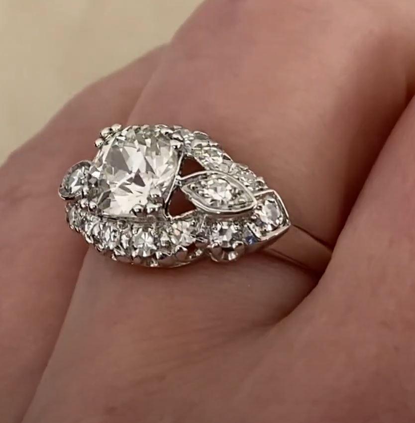 This exquisite antique ring is a true testament to the craftsmanship of the Art Deco era, dating back to the 1930s. At its center is a stunning GIA-certified approx. 1.20-carat old European cut diamond, boasting a warm K color and eye-catching SI2