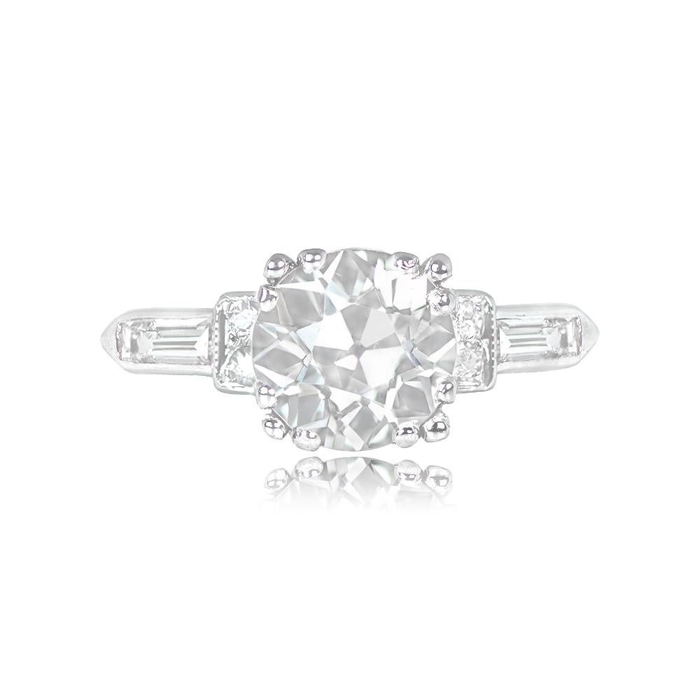This Art Deco platinum ring showcases a magnificent GIA-certified 1.63-carat old European cut diamond, elegantly secured in a box-prong setting. Complementing its beauty, approximately 0.14 carats of smaller diamonds and diamond baguettes adorn the
