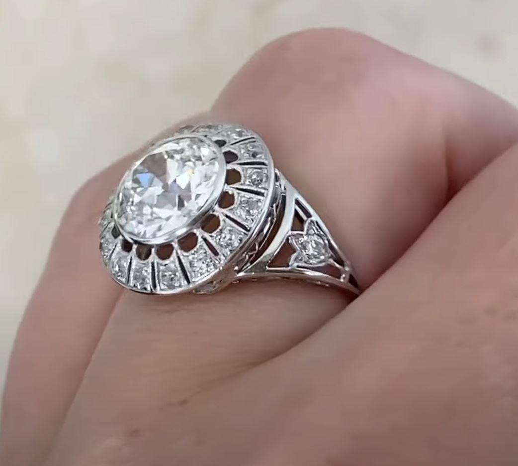 This exquisite antique engagement ring showcases a breathtaking GIA-certified old European cut diamond at its center, weighing approx. 2.20-carats. With a J color grade and VS1 clarity, the diamond radiates exceptional brilliance and charm.