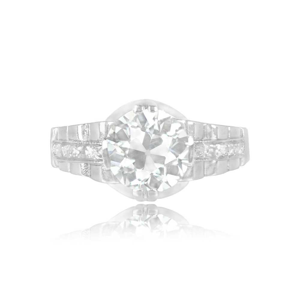 This Art Deco era diamond engagement ring features a GIA-certified old European cut diamond at its center, weighing 2.27 carats with K color and VS1 clarity. The ring's shoulders are adorned with single-cut diamonds, and delicate filigree details