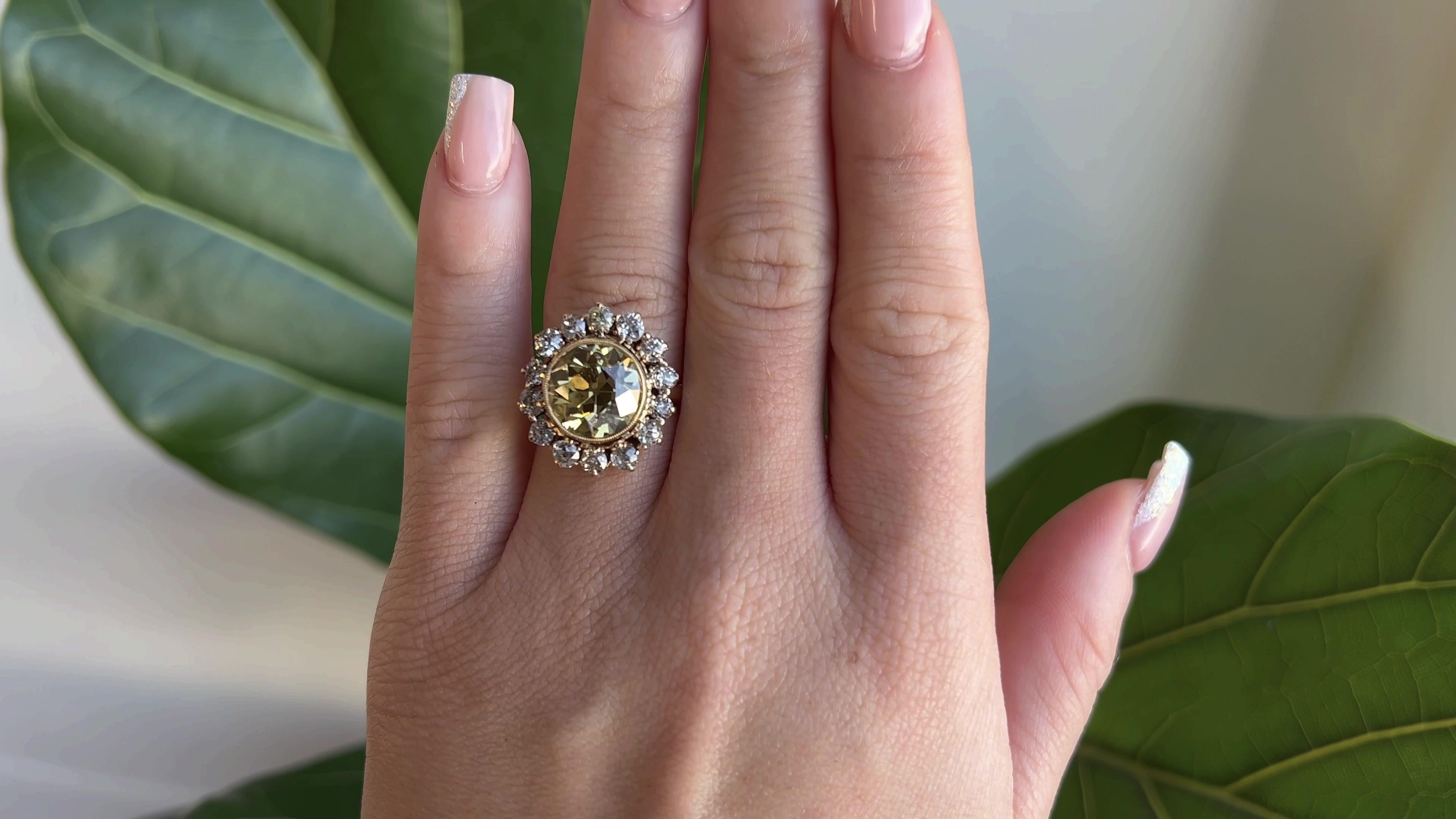 One Antique GIA 5.79 Carat Old European Fancy Brown-Yellow Diamond Gold Cluster Ring. Featuring one GIA certified old European cut diamond of 5.79 carats, accompanied with certificate #5222240027 stating the diamond is fancy brown-yellow color.