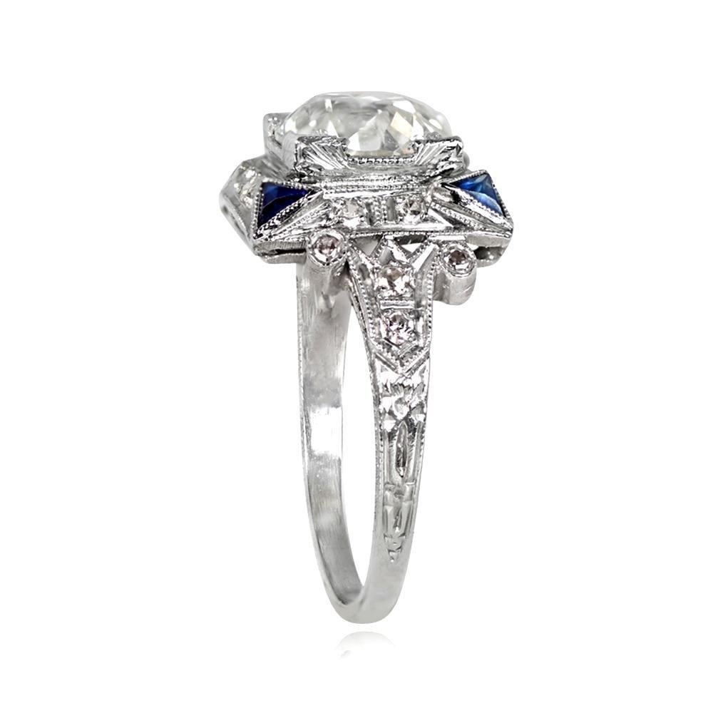 Art Deco Era ring with GIA-certified old European cut diamond and sapphire accents on the shoulders. Milgrain, diamonds, and openwork filigree decorate the gallery. Handcrafted circa 1920.

Ring Size: 6.5 US, Resizable 
Diamond Size: Approximately
