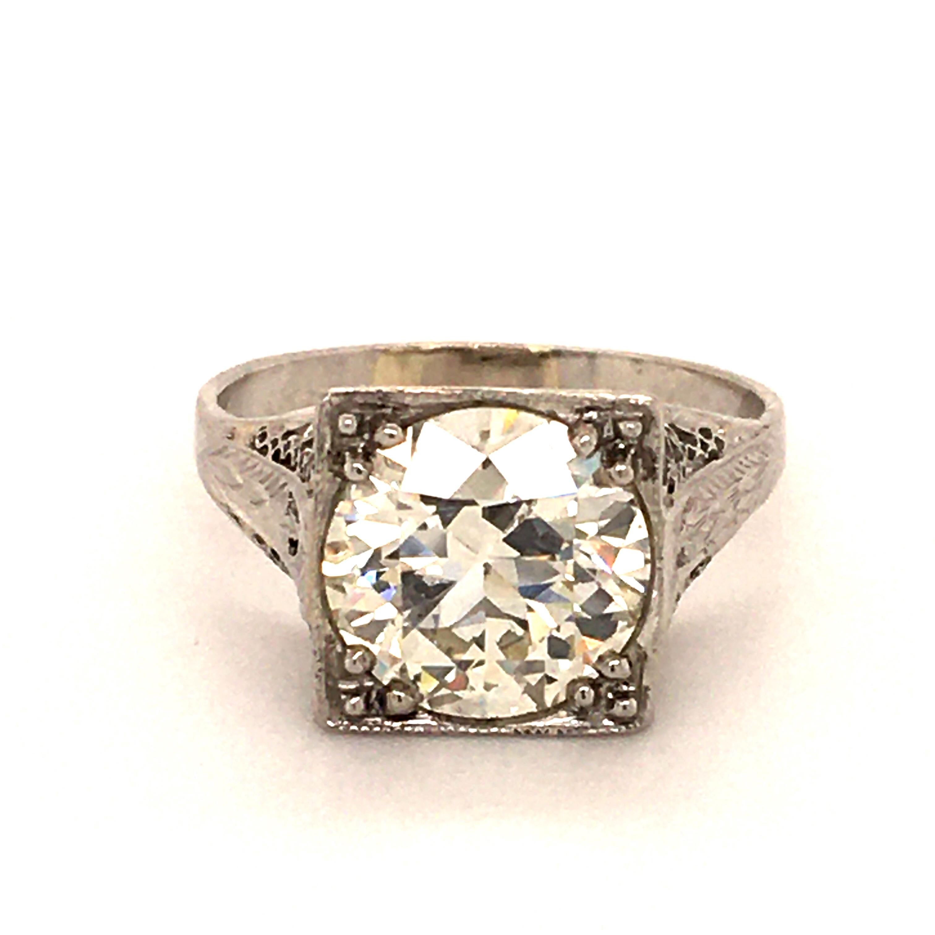 Early Art Deco filigree setting in Platinum 950. Set with a wonderful old cut Diamond of 3.08 ct. The charming gemstone is accompanied by GIA report stating that the Diamond is of M Color and vs1 clarity. A true pearl of an antique piece of jewelry.